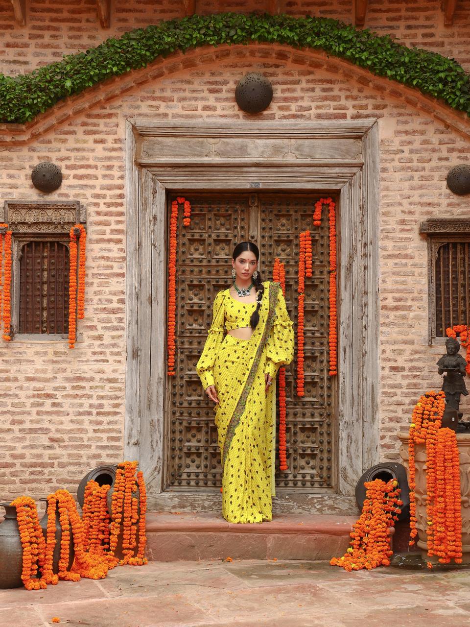 A model showcasing Tiana Drape Saree Set by Miku Kumar from Miku Kumar's collection
