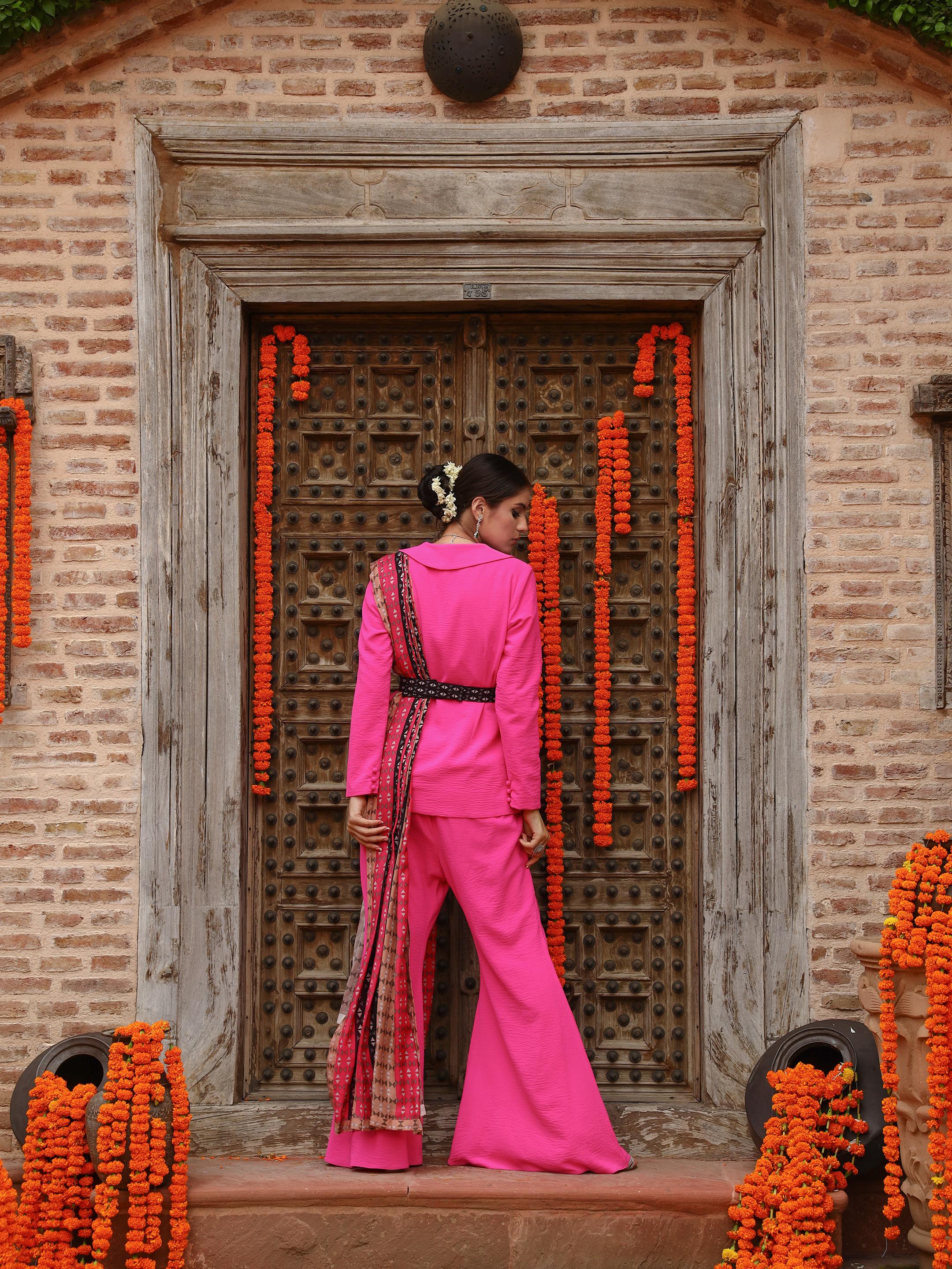 A model showcasing Zaara Jacket Sharara Set by Miku Kumar from Miku Kumar's collection
