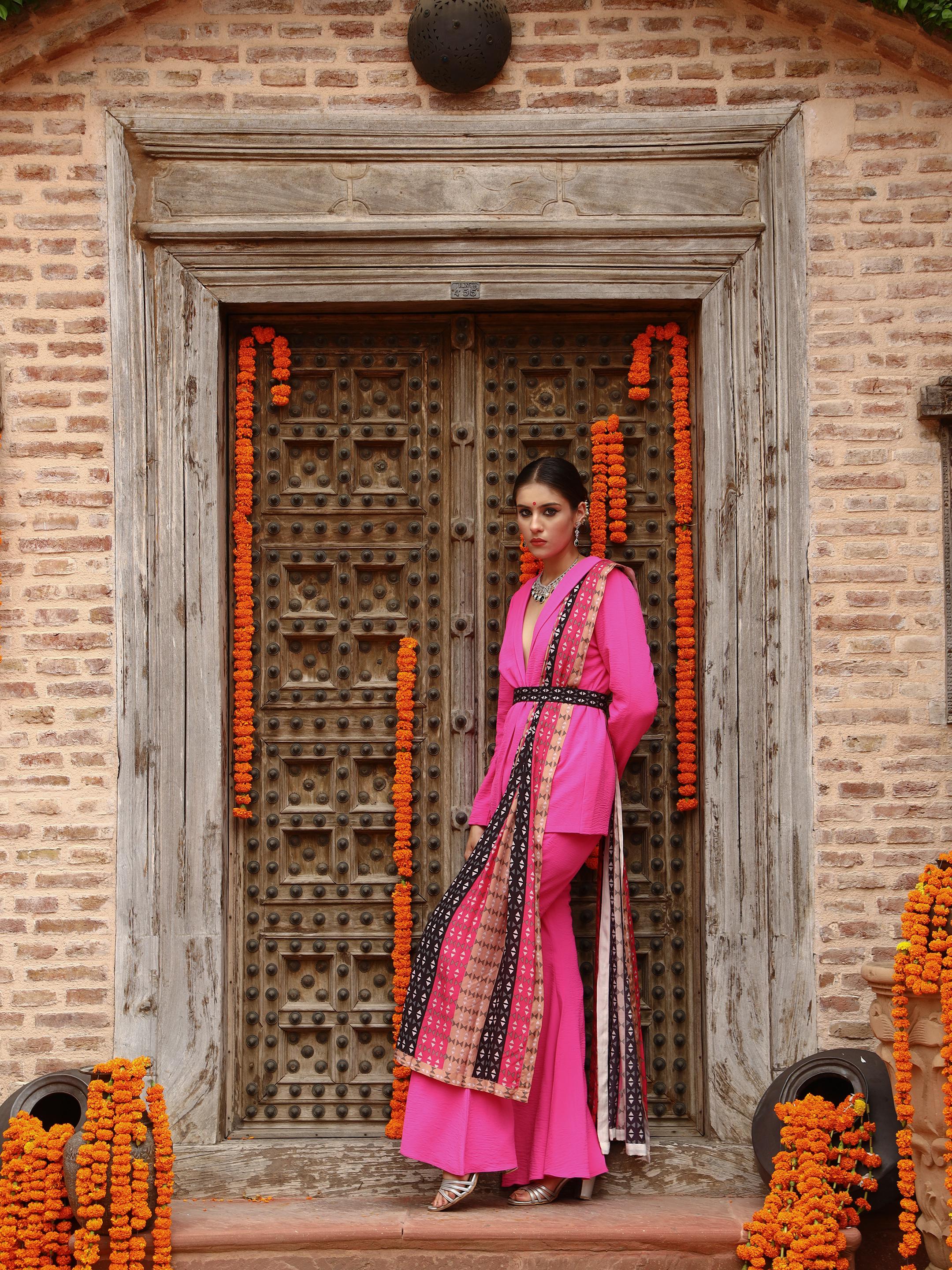A model showcasing Zaara Jacket Sharara Set by Miku Kumar from Miku Kumar's collection