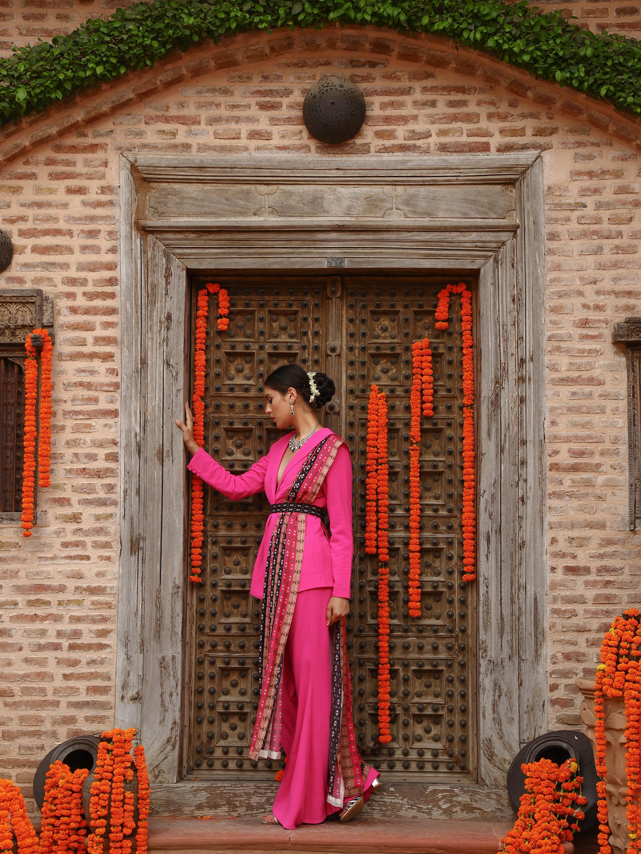 A model showcasing Zaara Jacket Sharara Set by Miku Kumar from Miku Kumar's collection