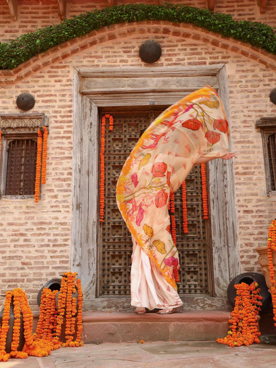 A model showcasing Levi Cape Skirt Set by Miku Kumar from Miku Kumar's collection