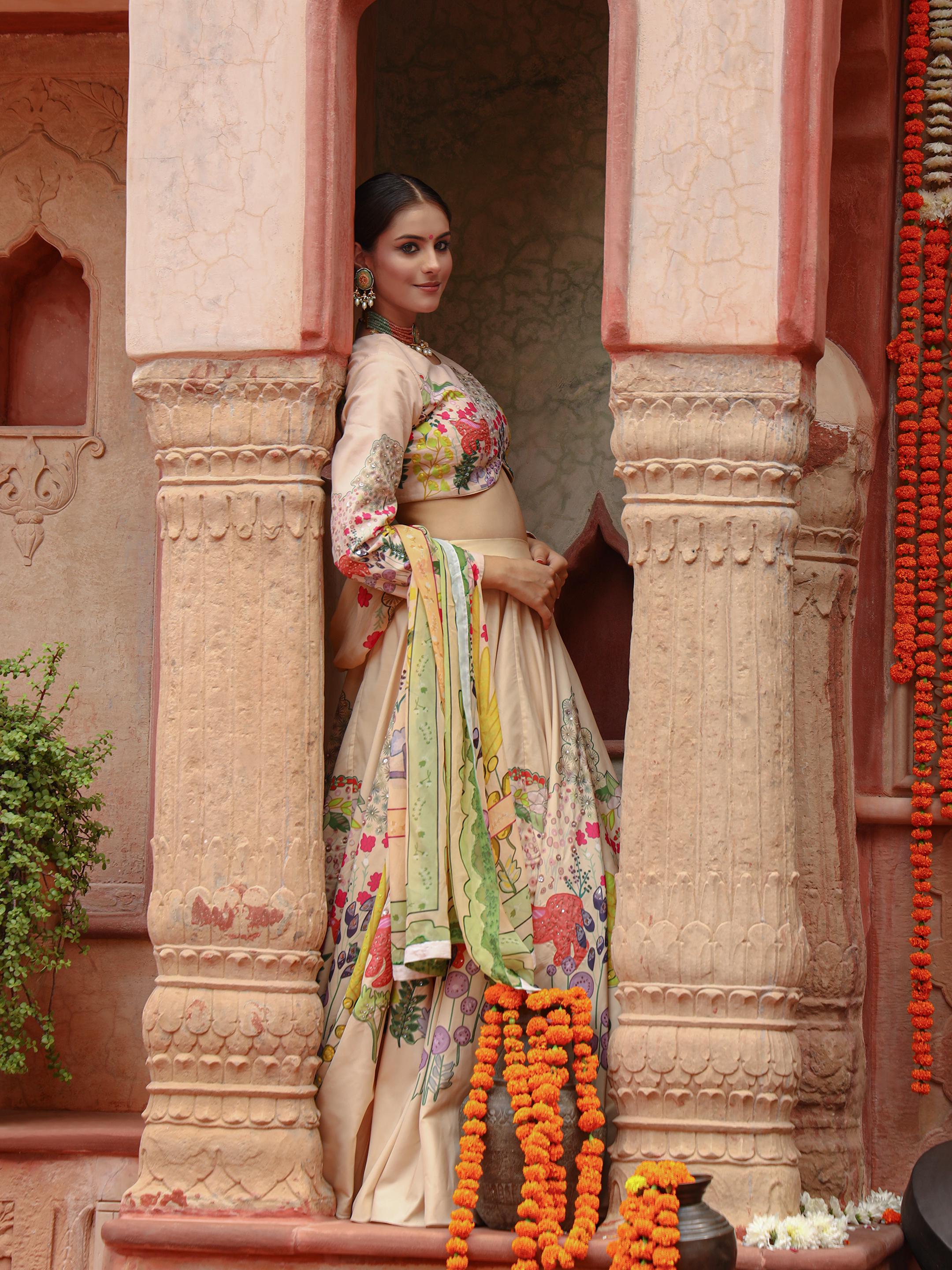 A model showcasing Shanvi Lehenga Set by Miku Kumar from Miku Kumar's collection