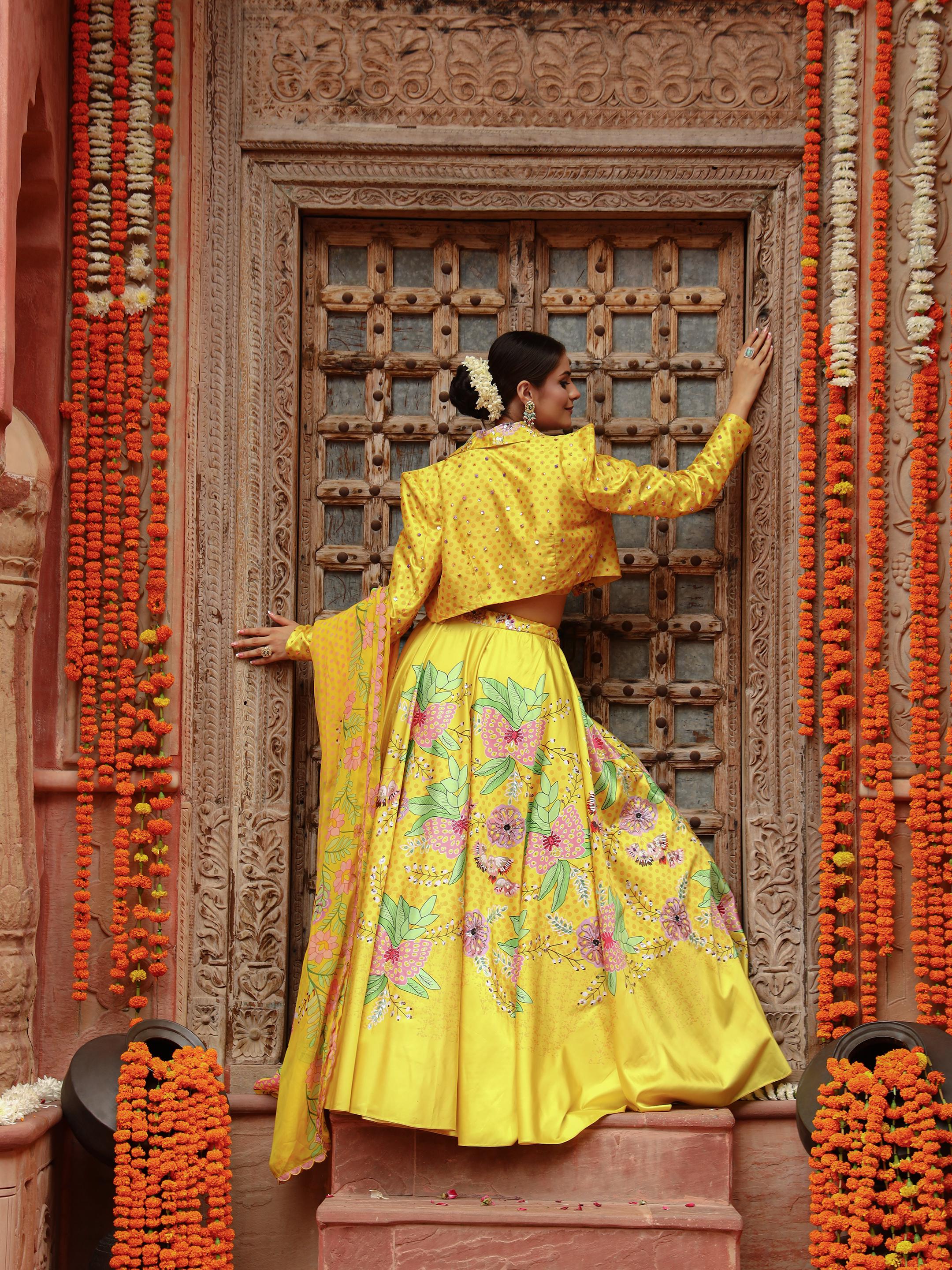 A model showcasing Roma Jacket Lehenga Set by Miku Kumar from Miku Kumar's collection