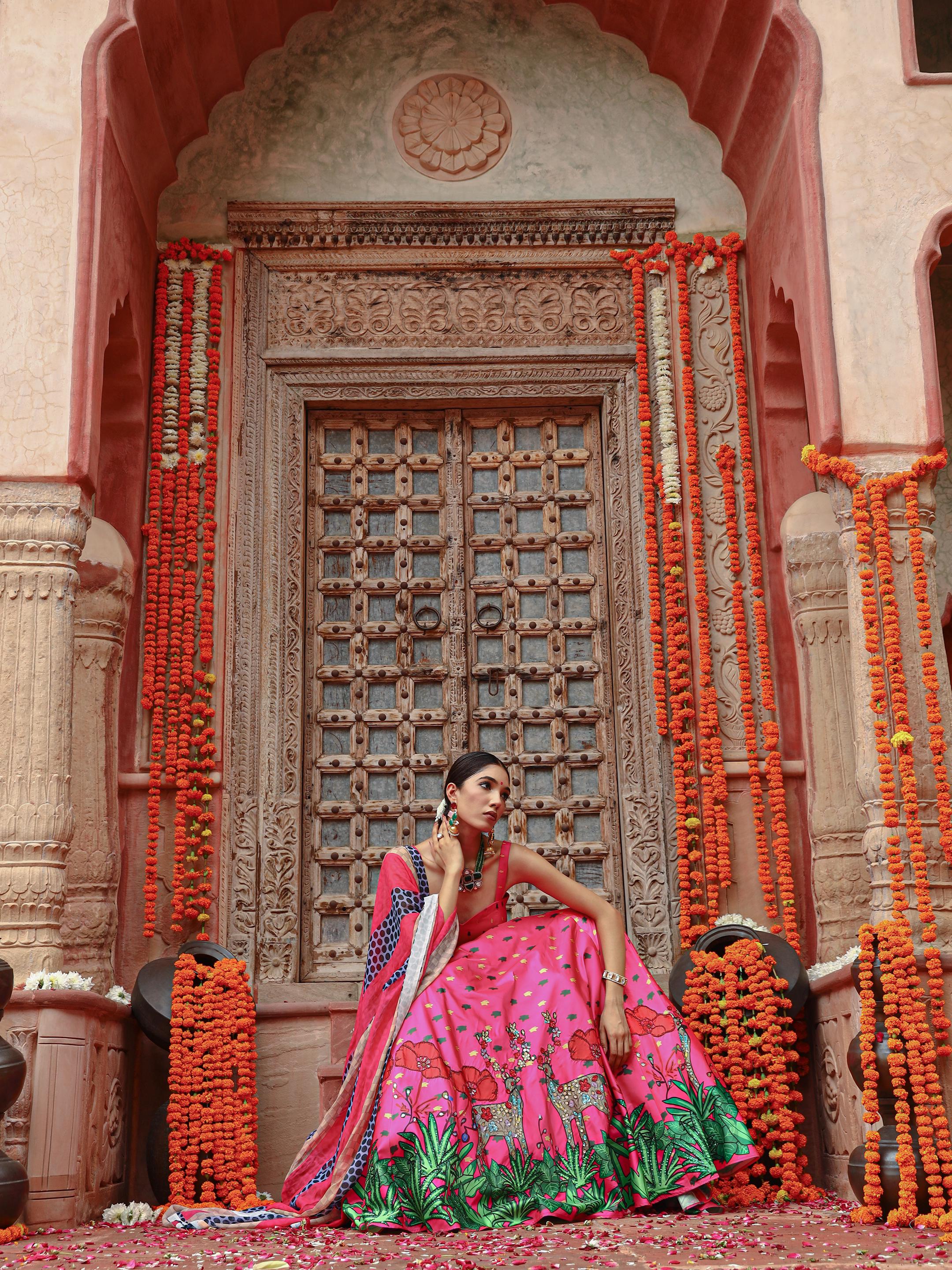 A model showcasing Zooni Lehenga Set by Miku Kumar from Miku Kumar's collection