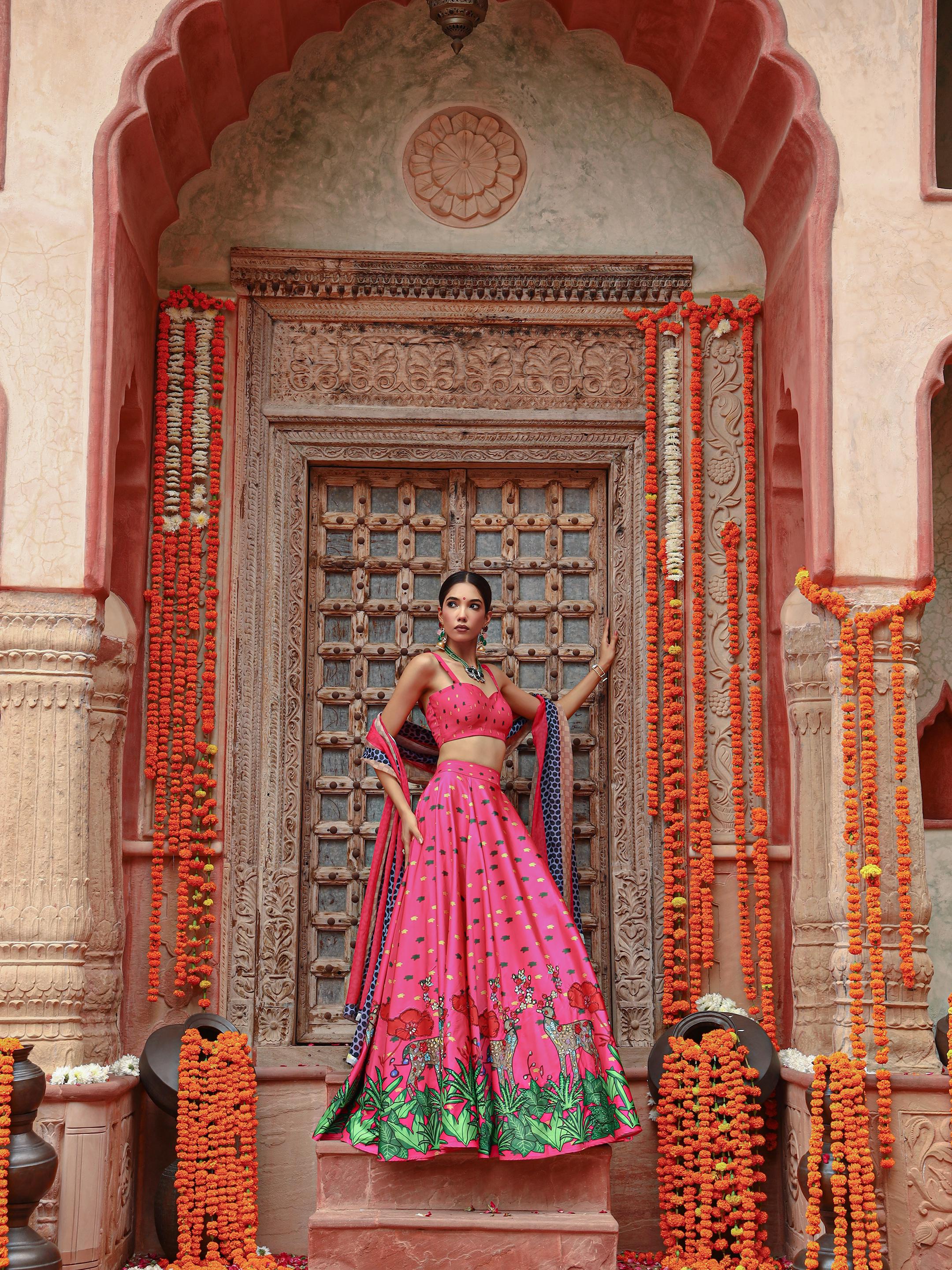 A model showcasing Zooni Lehenga Set by Miku Kumar from Miku Kumar's collection