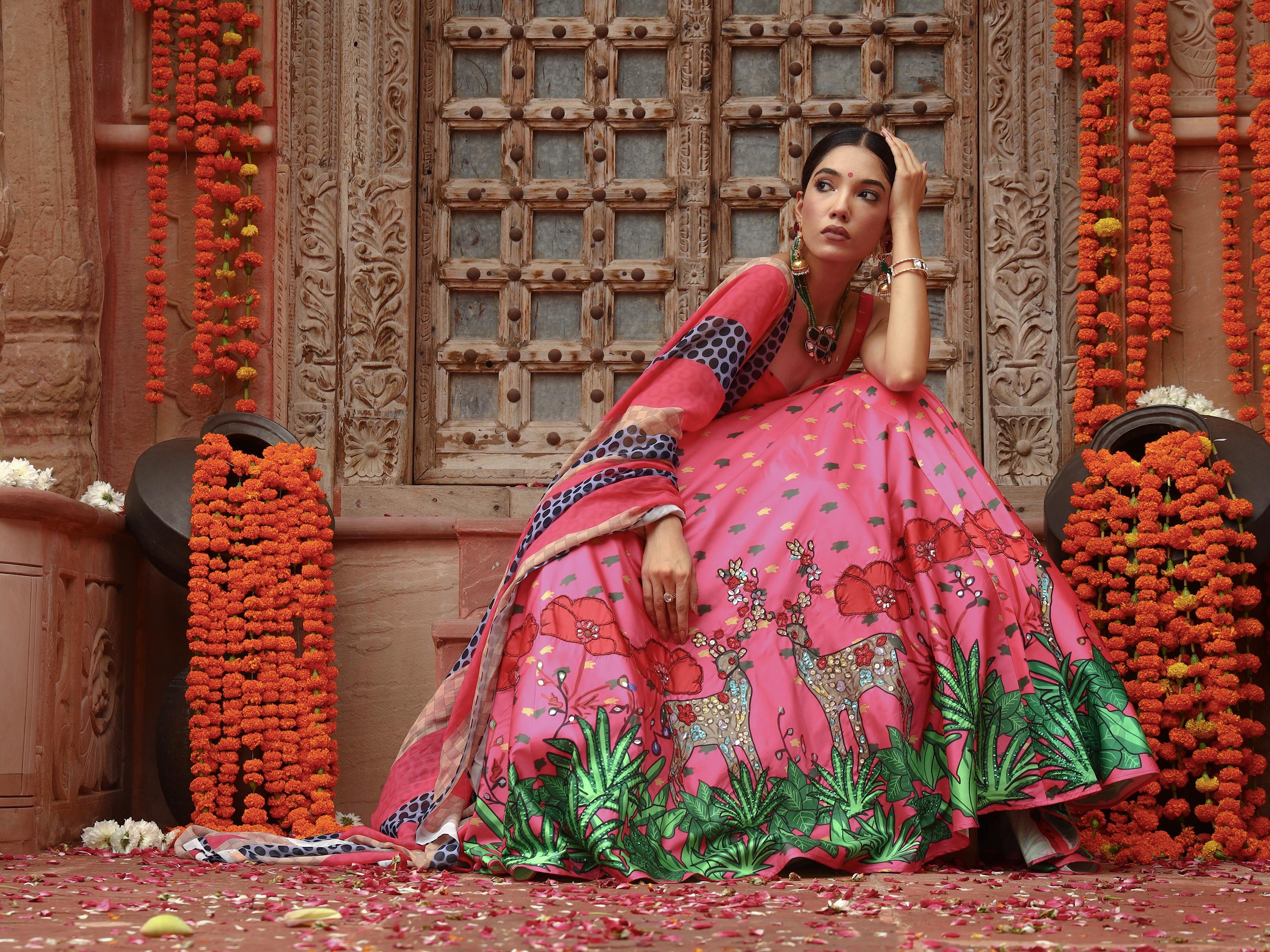 A model showcasing Zooni Lehenga Set by Miku Kumar from Miku Kumar's collection