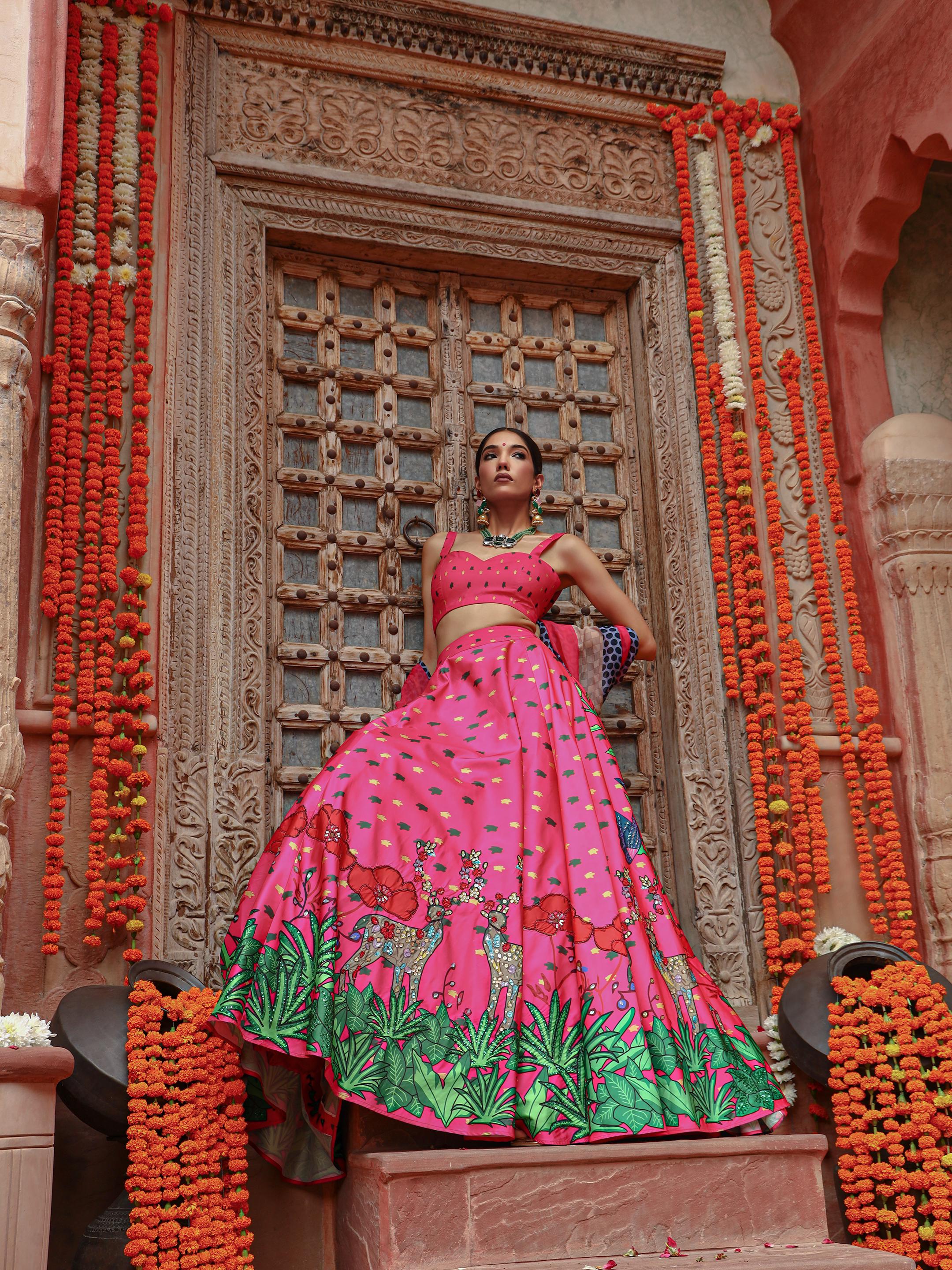 A model showcasing Zooni Lehenga Set by Miku Kumar from Miku Kumar's collection