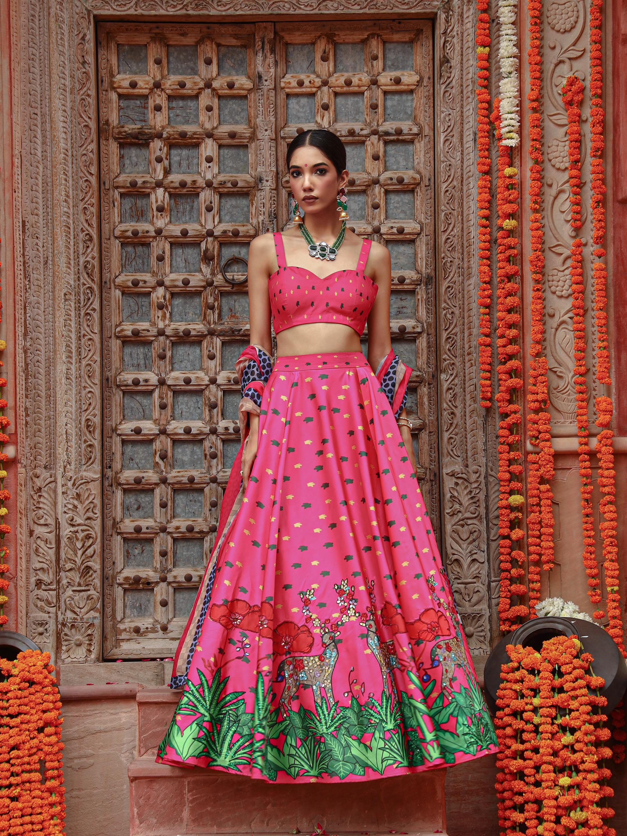 A model showcasing Zooni Lehenga Set by Miku Kumar from Miku Kumar's collection