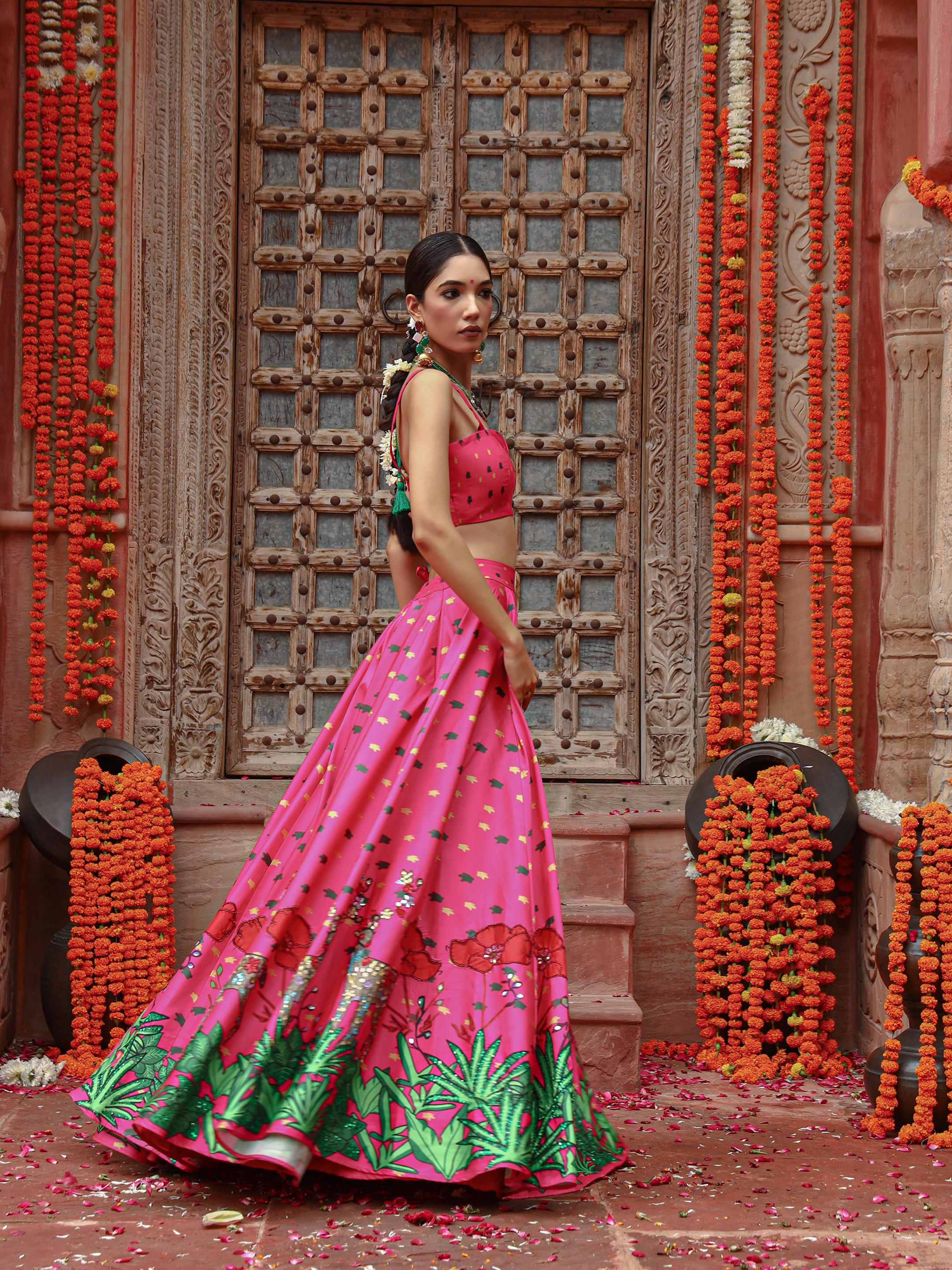 A model showcasing Zooni Lehenga Set by Miku Kumar from Miku Kumar's collection