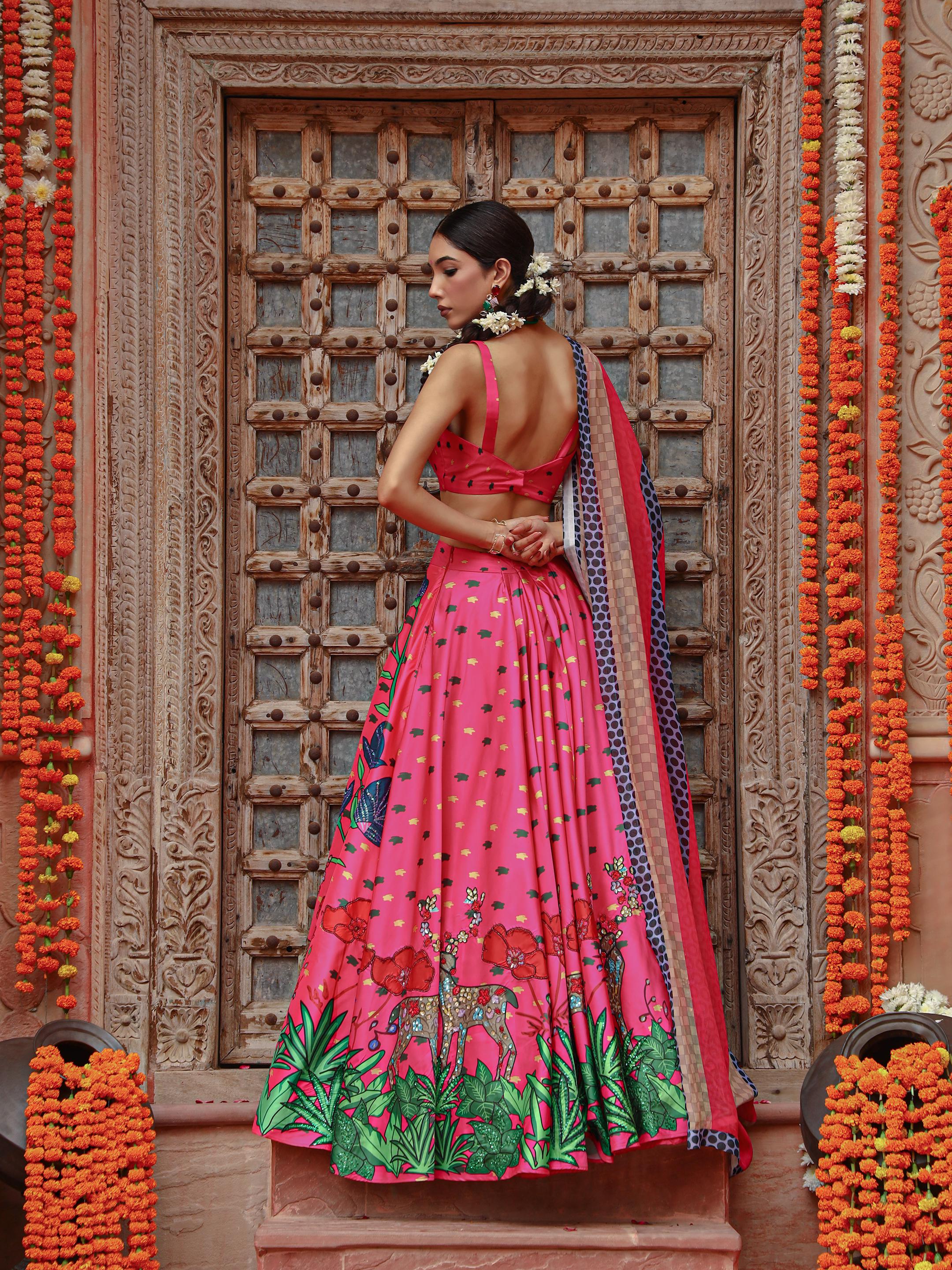 A model showcasing Zooni Lehenga Set by Miku Kumar from Miku Kumar's collection