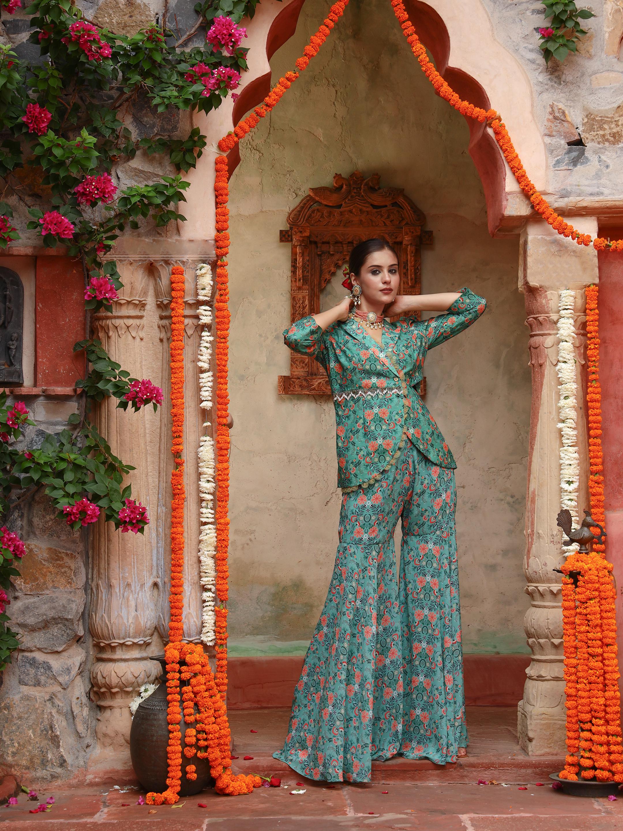 A model showcasing Iris Sharara Set by Miku Kumar from Miku Kumar's collection