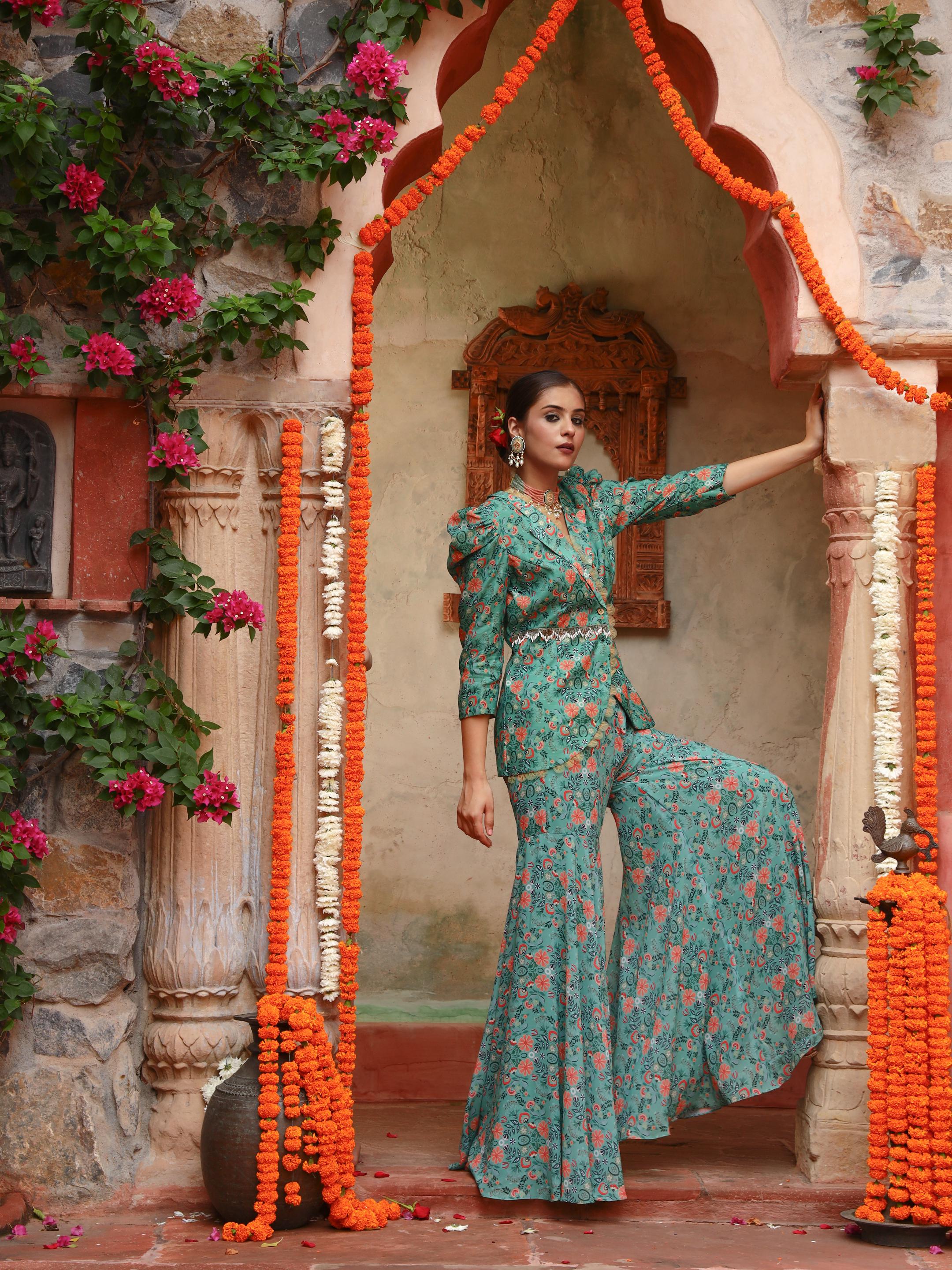 A model showcasing Iris Sharara Set by Miku Kumar from Miku Kumar's collection