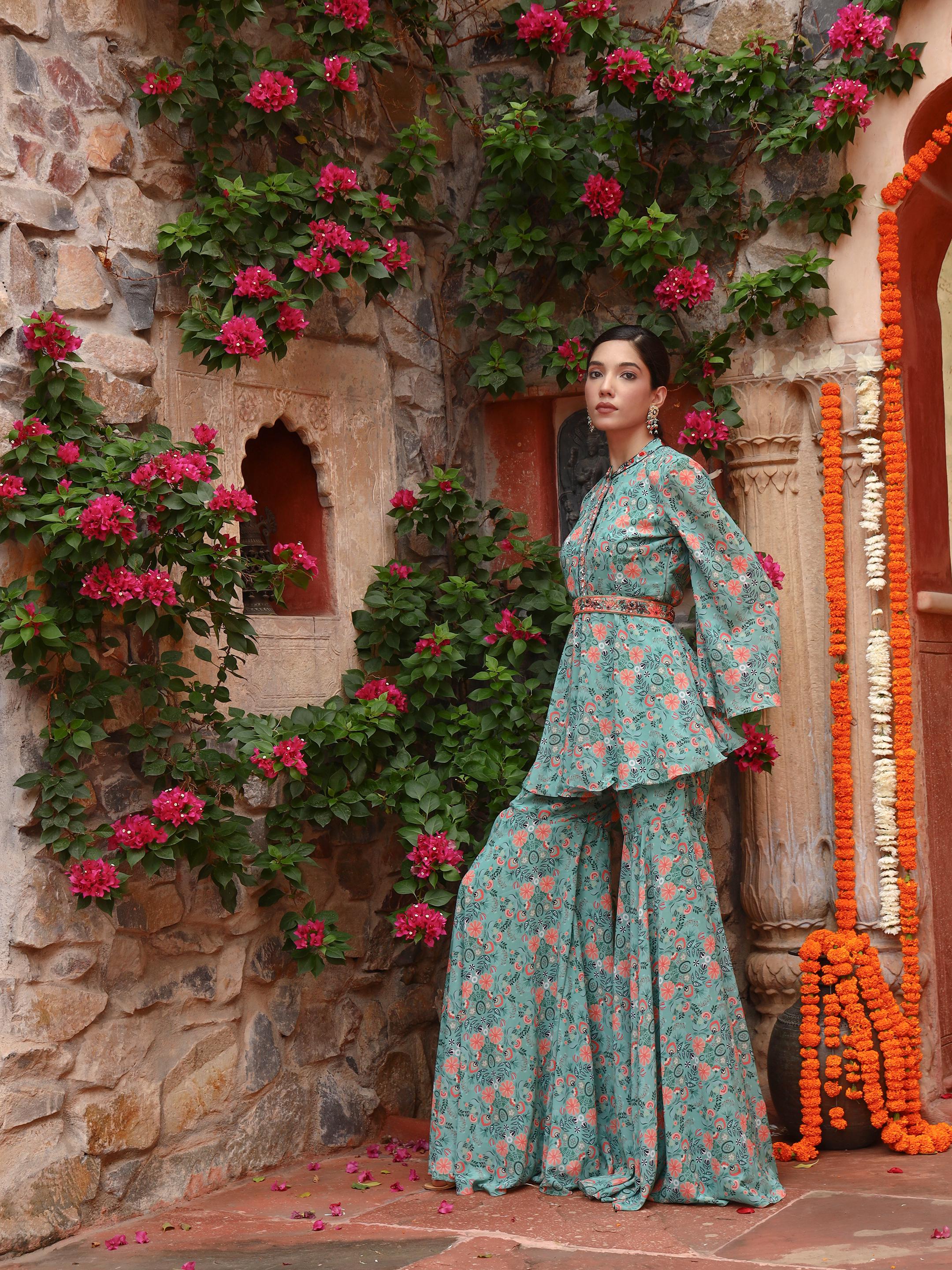 A model showcasing Peony Sharara Set by Miku Kumar from Miku Kumar's collection