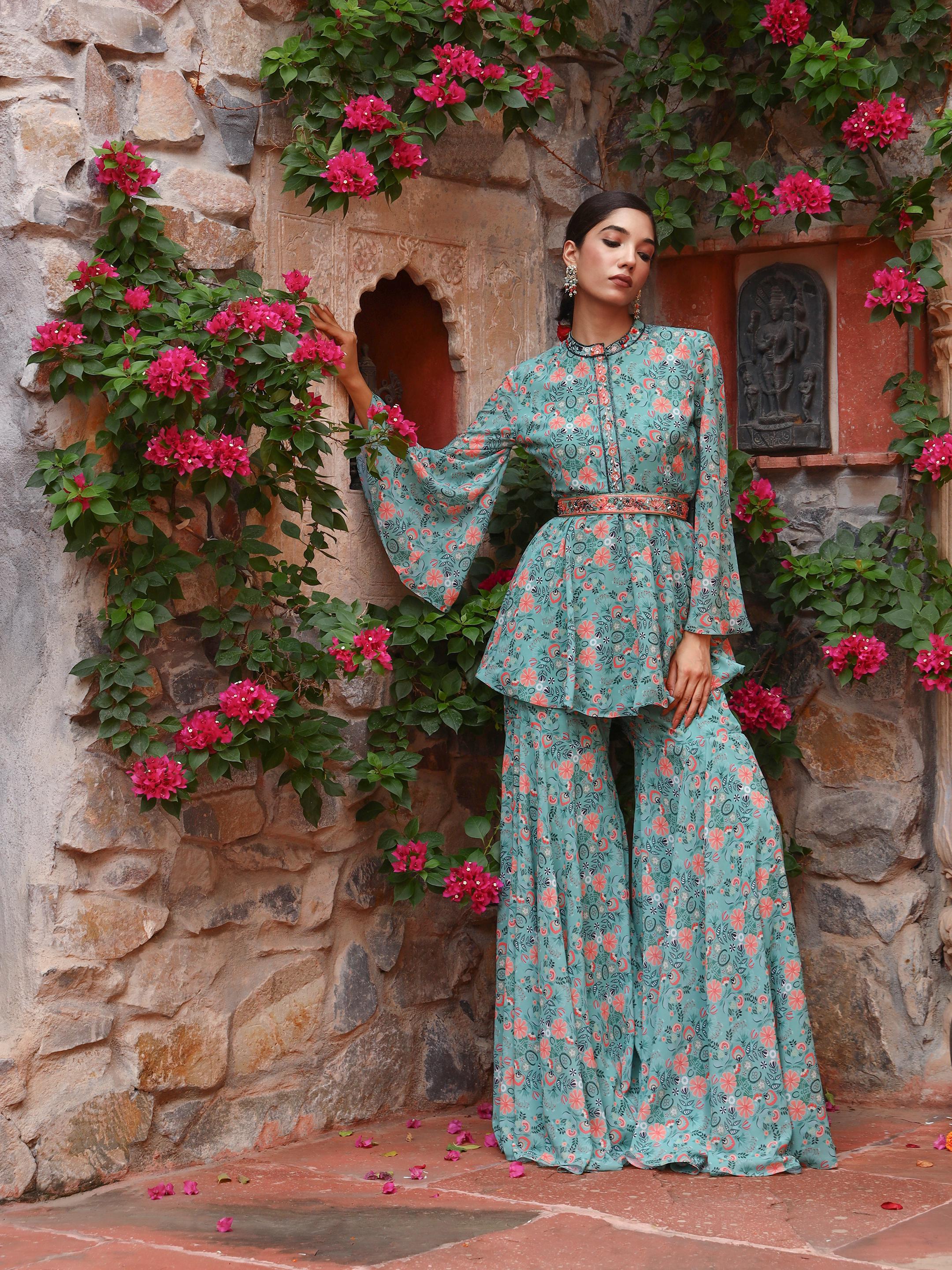 A model showcasing Peony Sharara Set by Miku Kumar from Miku Kumar's collection