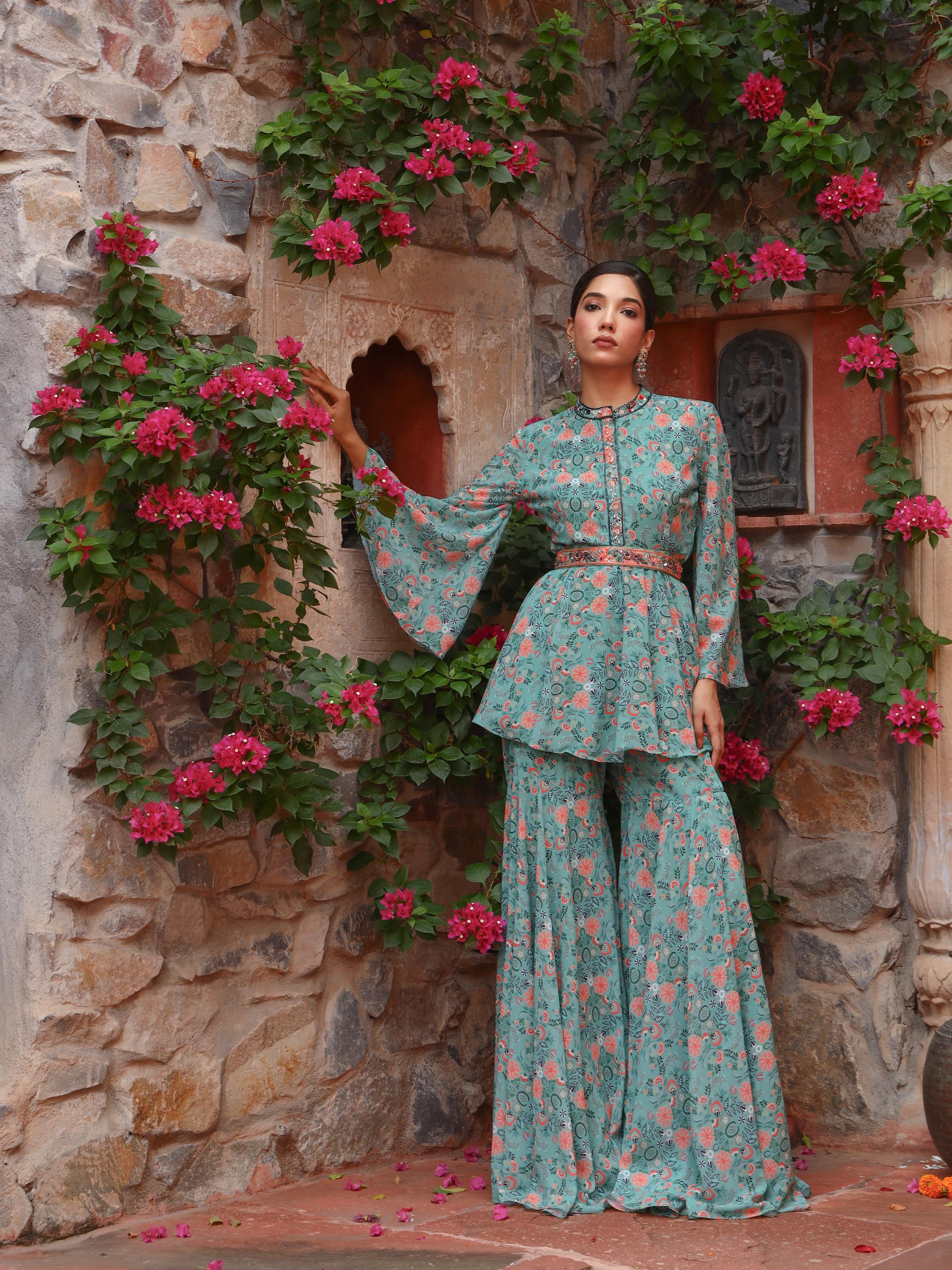 A model showcasing Peony Sharara Set by Miku Kumar from Miku Kumar's collection