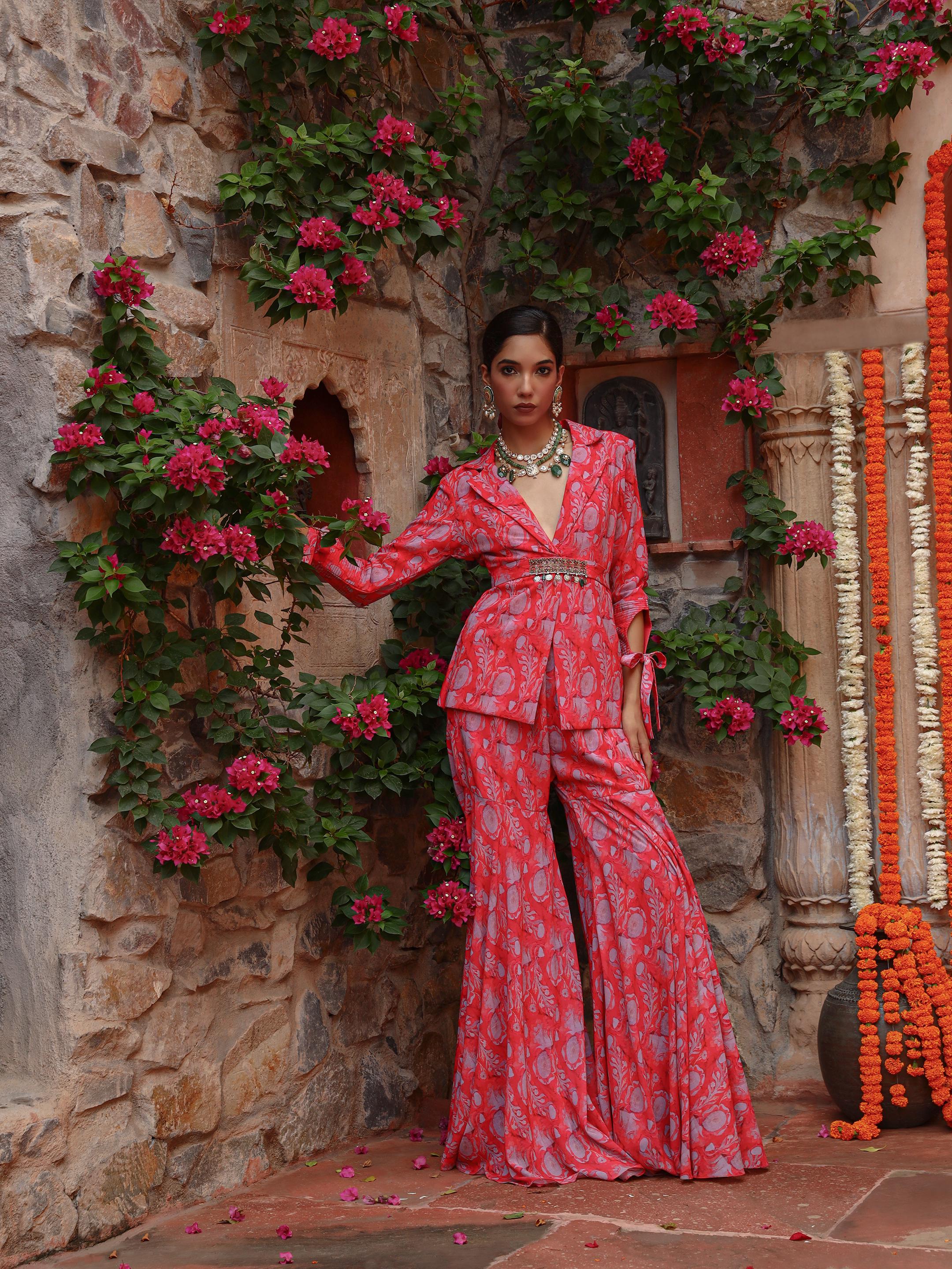 A model showcasing Carnation Sharara Set by Miku Kumar from Miku Kumar's collection