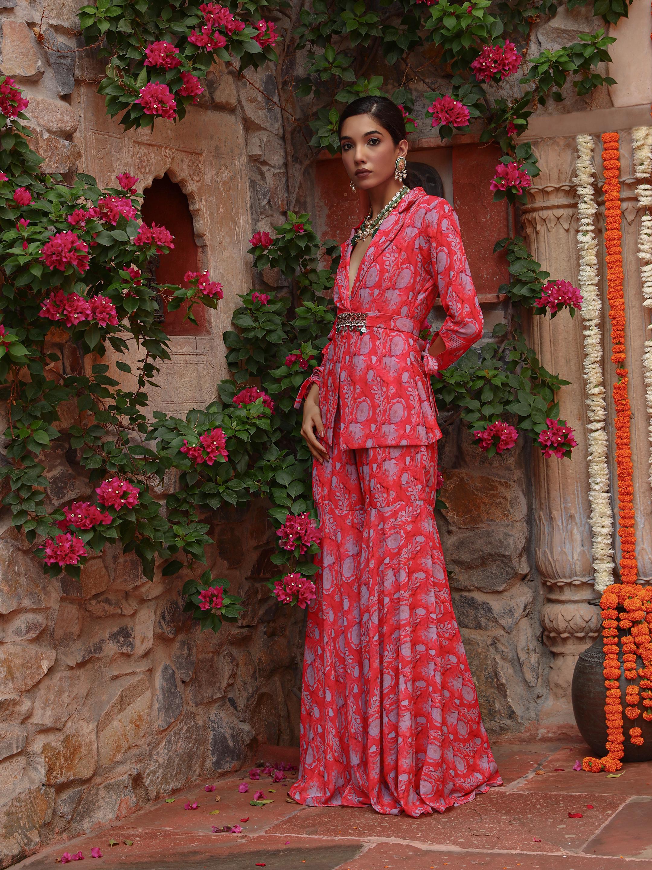 A model showcasing Carnation Sharara Set by Miku Kumar from Miku Kumar's collection
