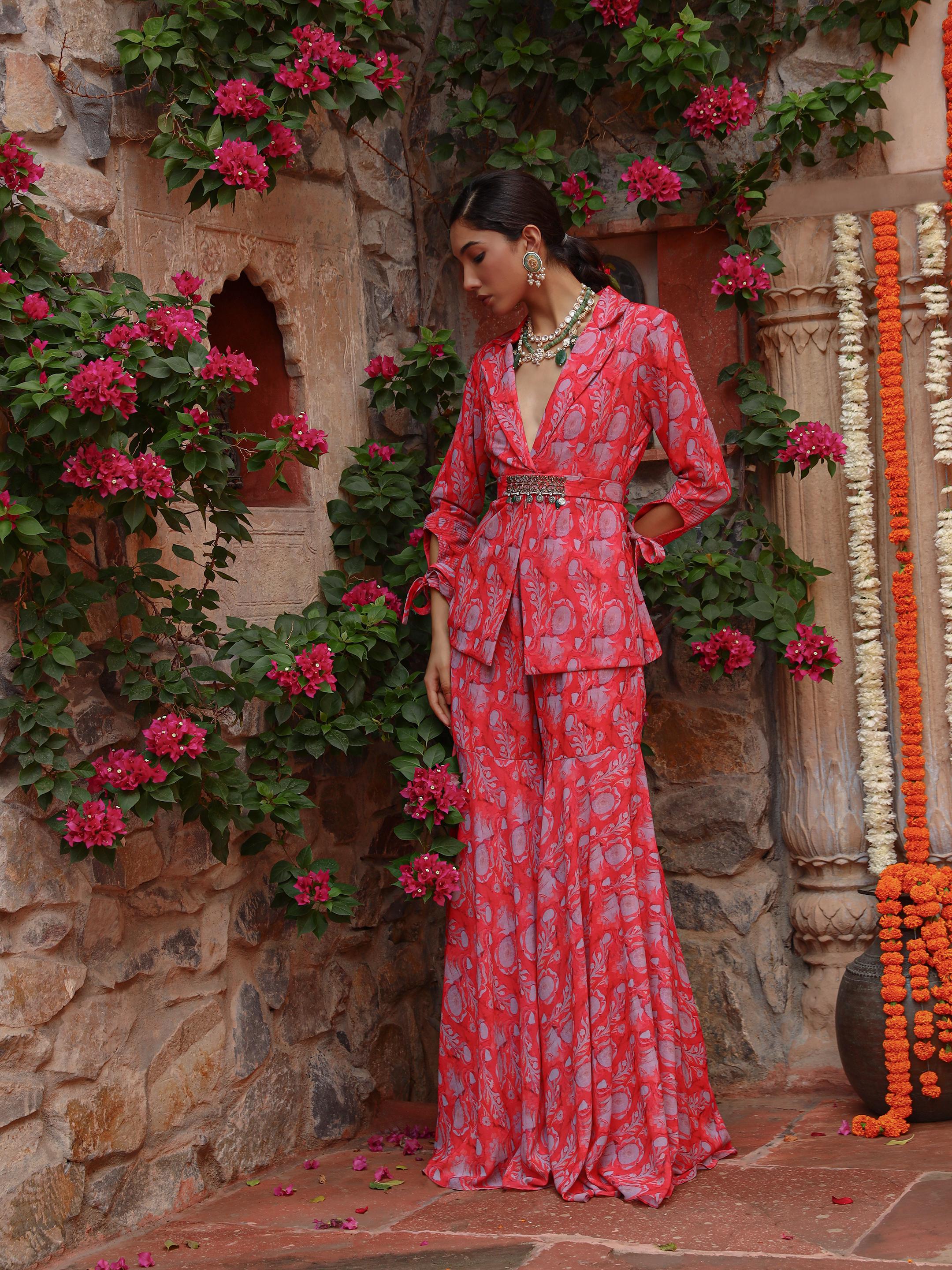 A model showcasing Carnation Sharara Set by Miku Kumar from Miku Kumar's collection