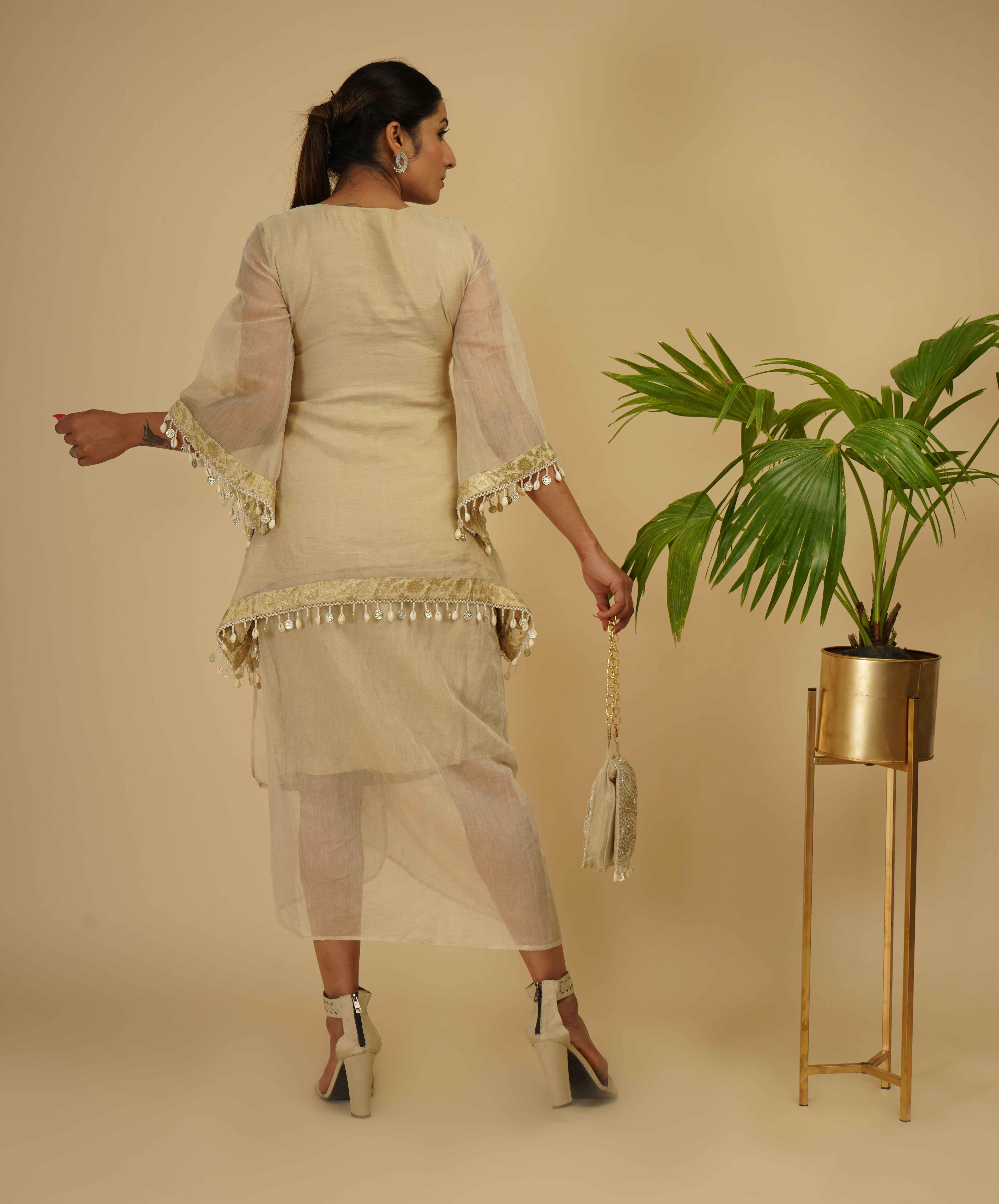 A model showcasing Drape Skirt With Boho Look Kaftan Kurta by Farha Syed from Farha Syed's collection