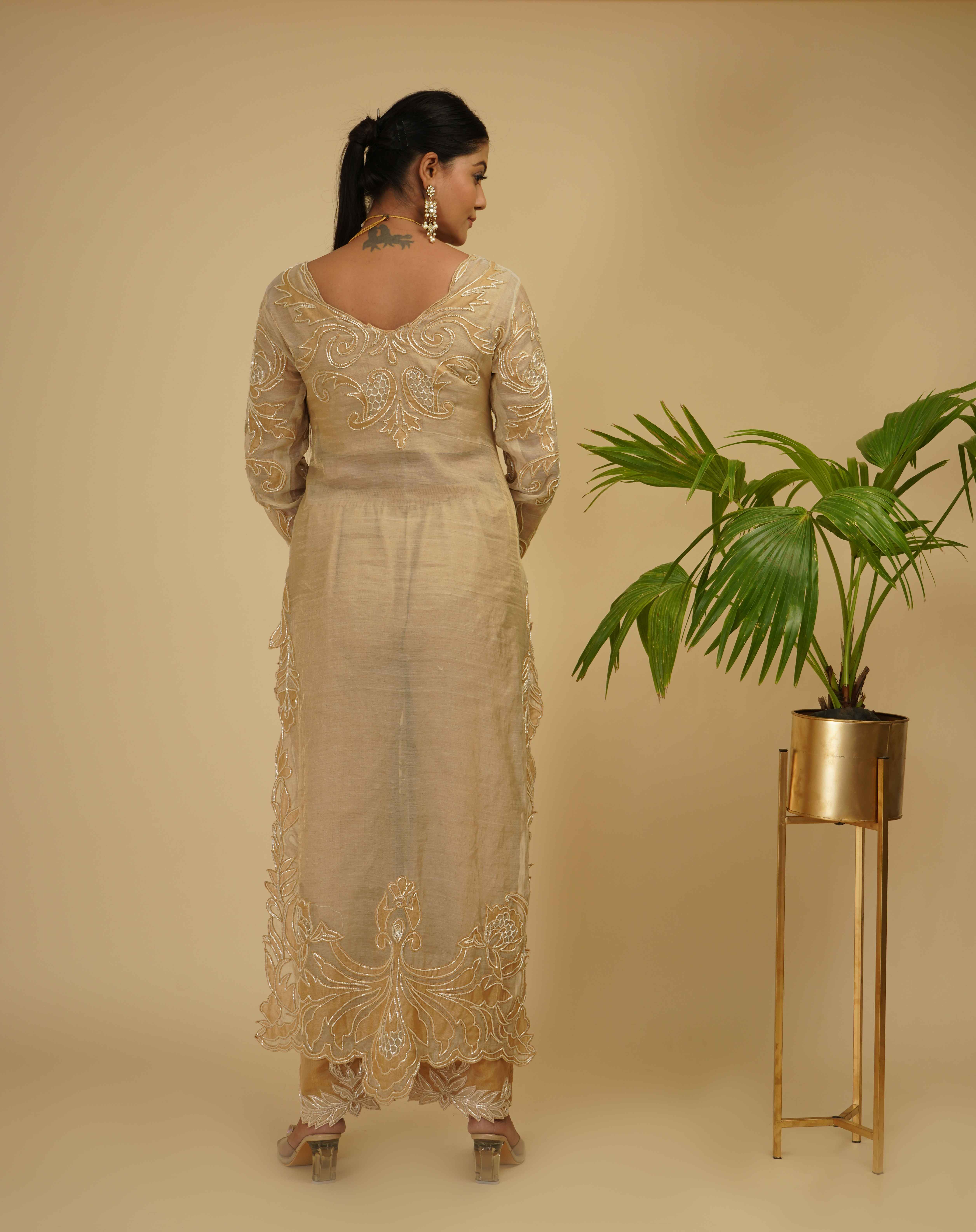 A model showcasing 2 Piece Kurta Set by Farha Syed from Farha Syed's collection