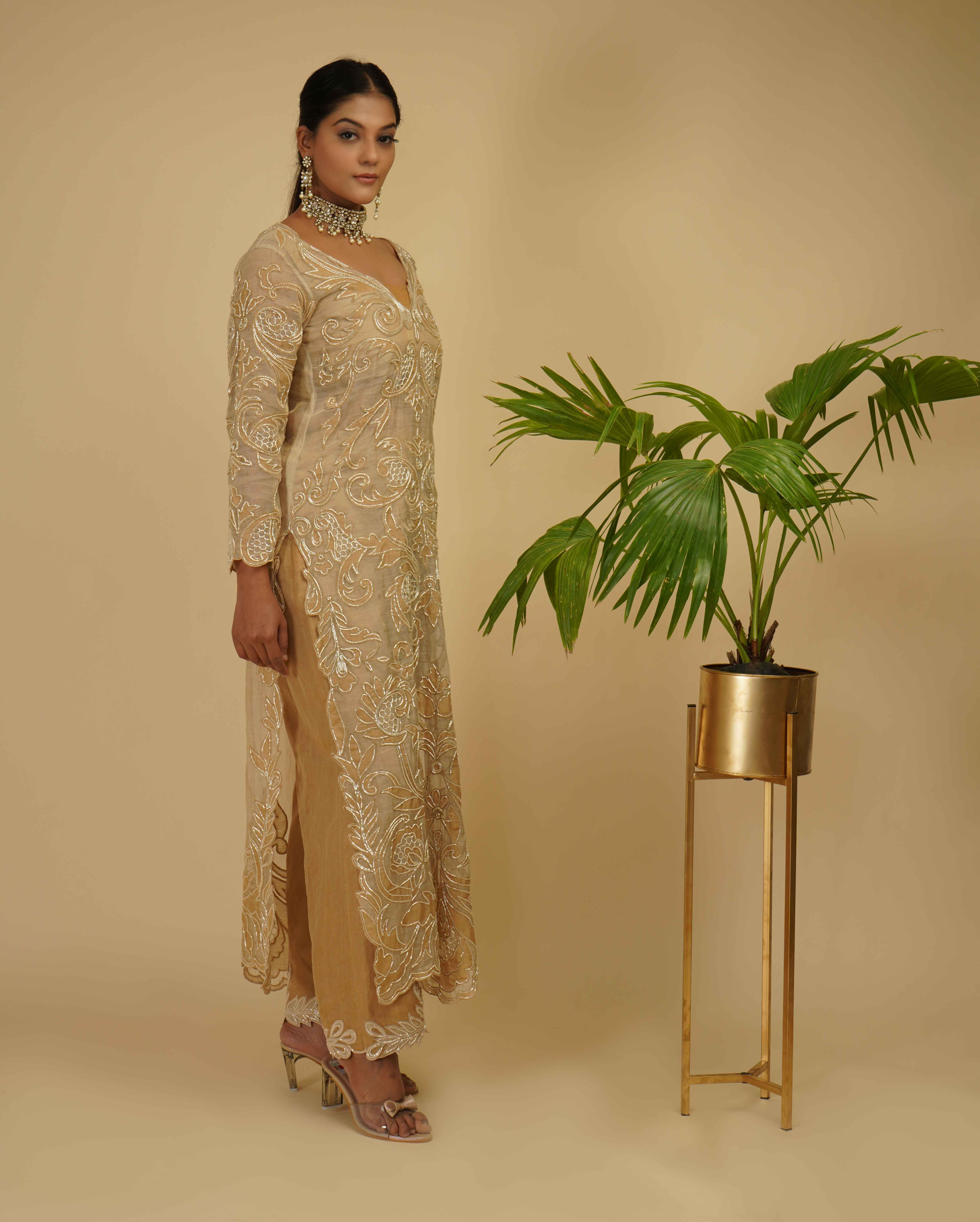 A model showcasing 2 Piece Kurta Set by Farha Syed from Farha Syed's collection