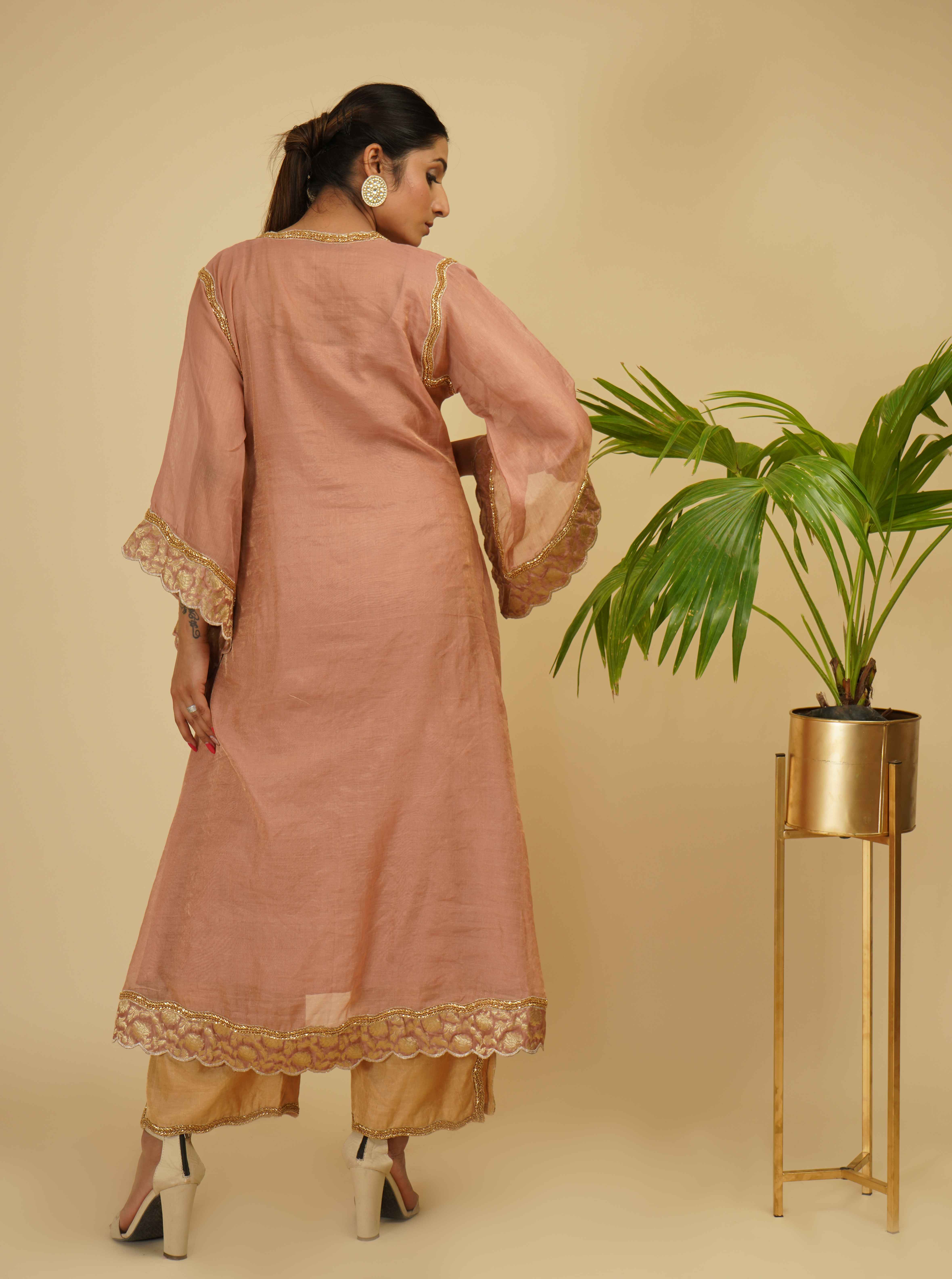 A model showcasing Kaftan Kurta Set by Farha Syed from Farha Syed's collection