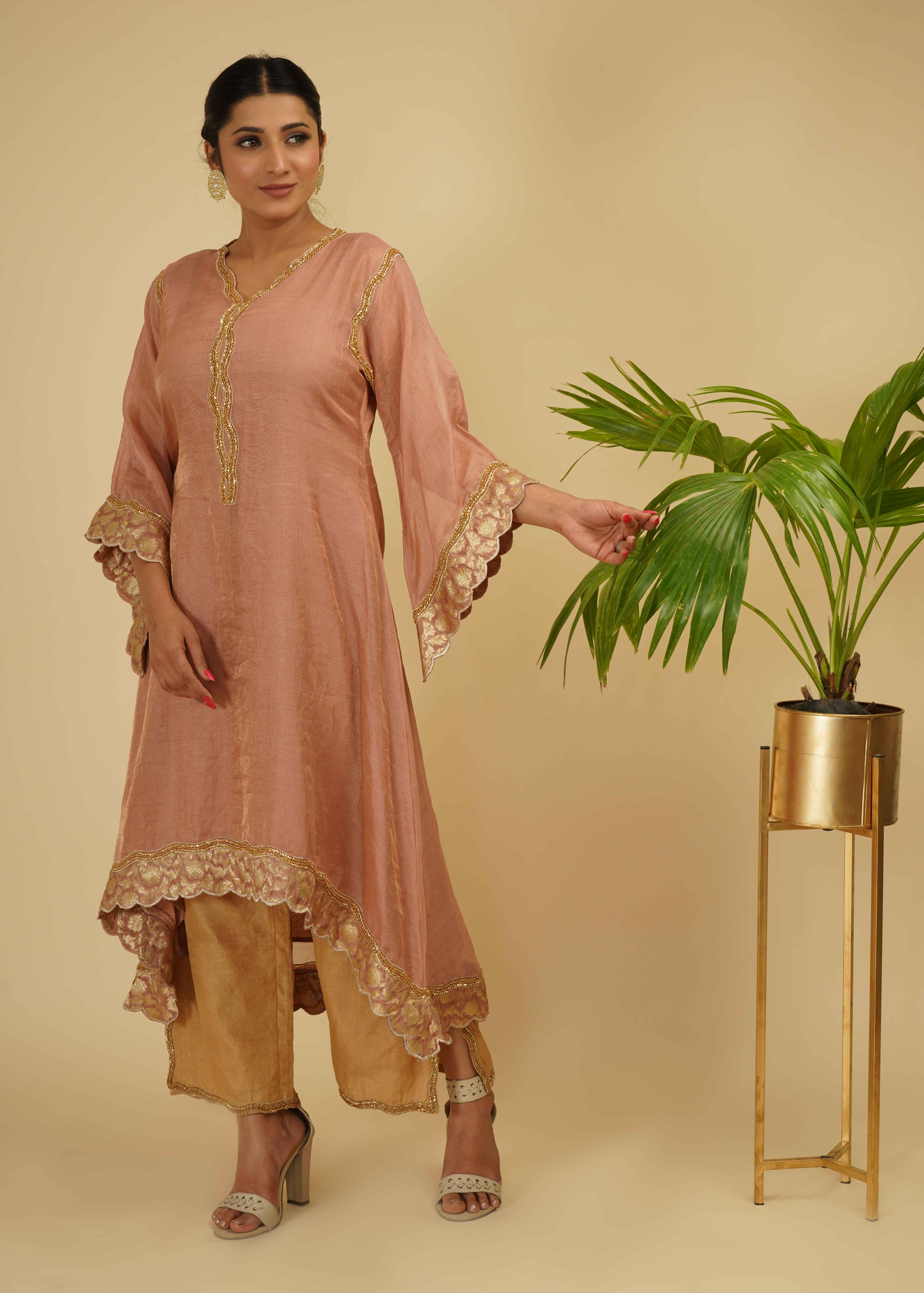 A model showcasing Kaftan Kurta Set by Farha Syed from Farha Syed's collection