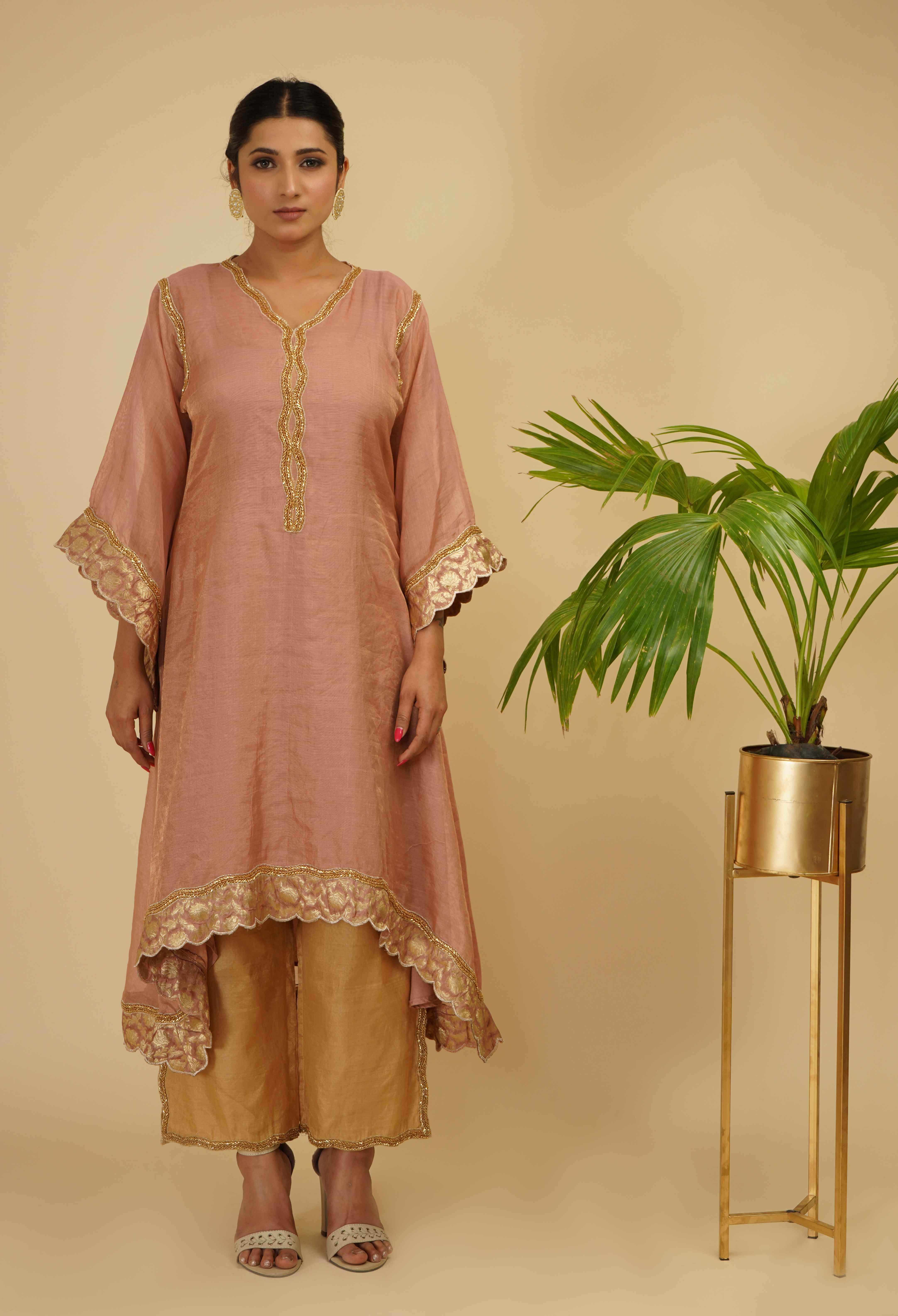 A model showcasing Kaftan Kurta Set by Farha Syed from Farha Syed's collection