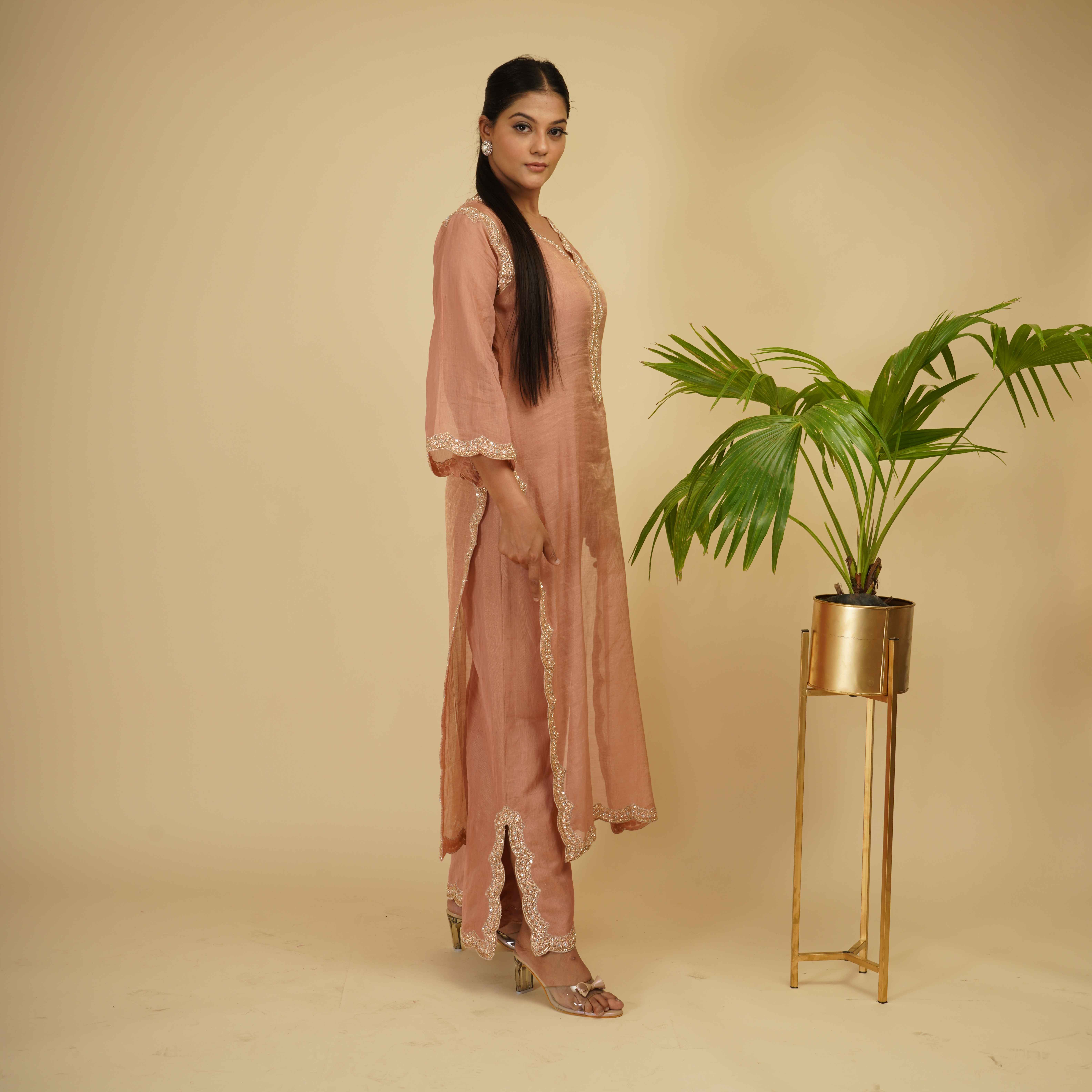A model showcasing 3 Piece Hand Embriodery Kurta Set by Farha Syed from Farha Syed's collection