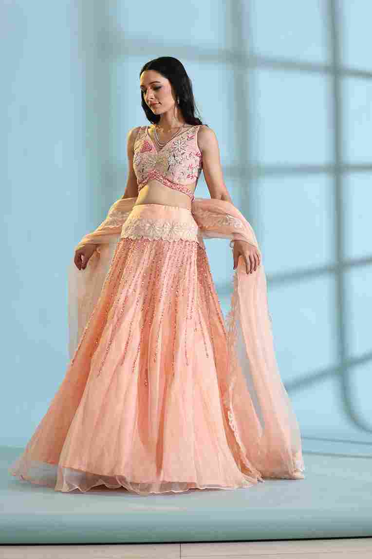 A model showcasing Peach Floral Lehenga by Adivaa from Adivaa's collection