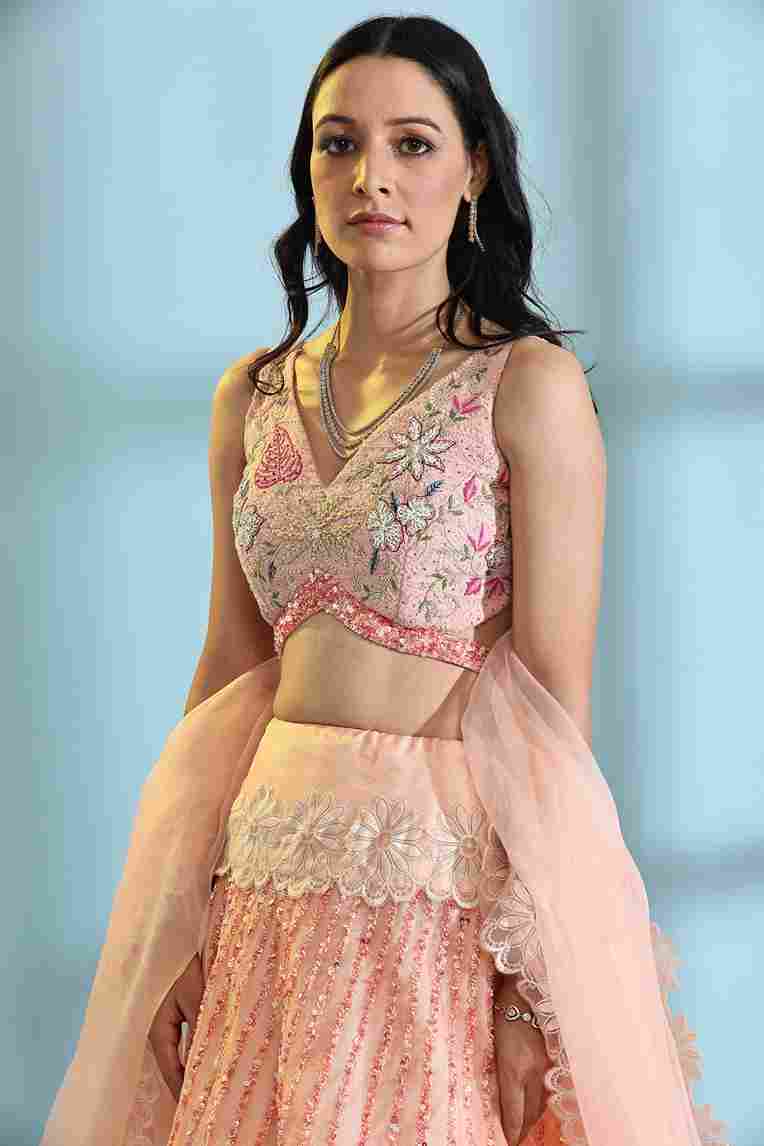 A model showcasing Peach Floral Lehenga by Adivaa from Adivaa's collection