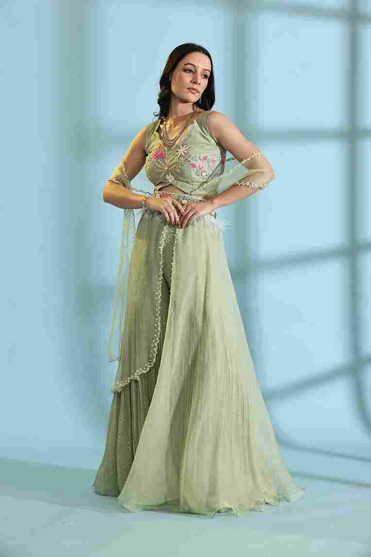 A model showcasing Olive Green Palazzo Sharara Dress by Adivaa from Adivaa's collection