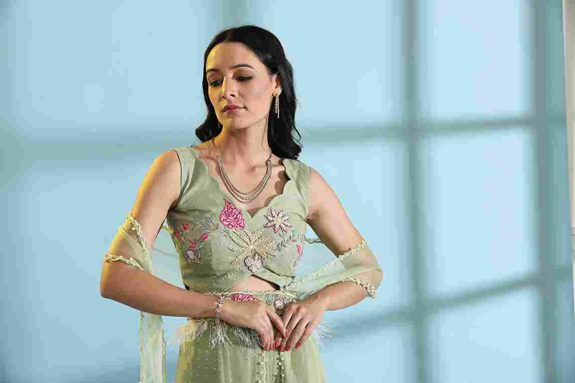A model showcasing Olive Green Palazzo Sharara Dress by Adivaa from Adivaa's collection