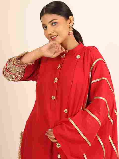 A model showcasing Red Long Kurta With Cigarette Pants by Adivaa from Adivaa's collection