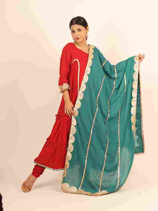 A model showcasing Red Flared Suit by Adivaa from Adivaa's collection