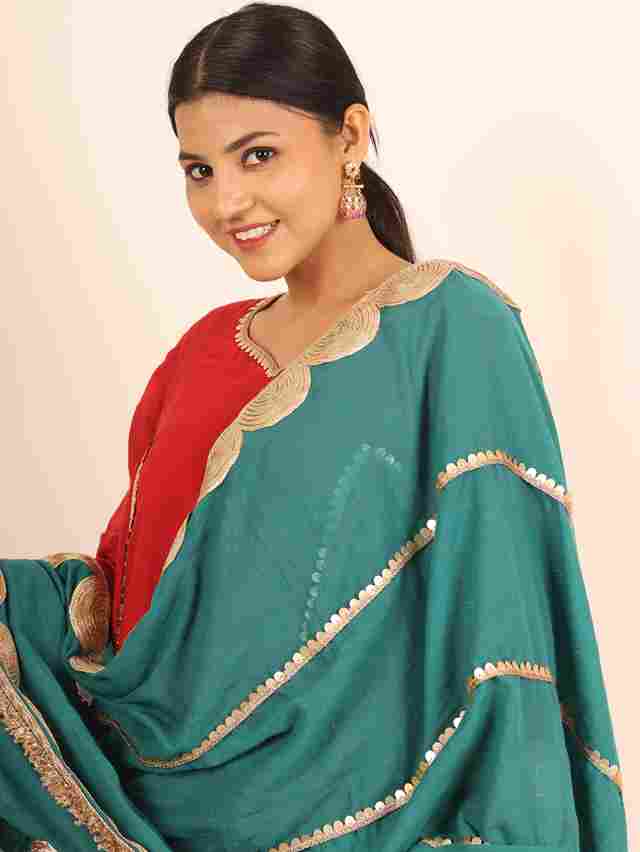 A model showcasing Red Flared Suit by Adivaa from Adivaa's collection