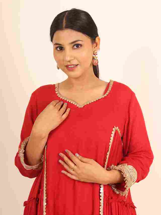 A model showcasing Red Flared Suit by Adivaa from Adivaa's collection
