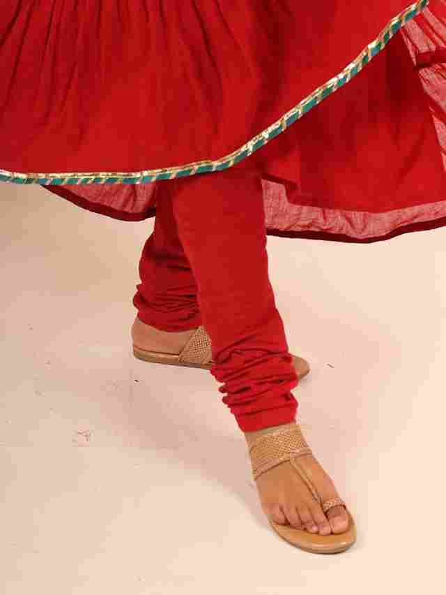 A model showcasing Red Flared Suit by Adivaa from Adivaa's collection
