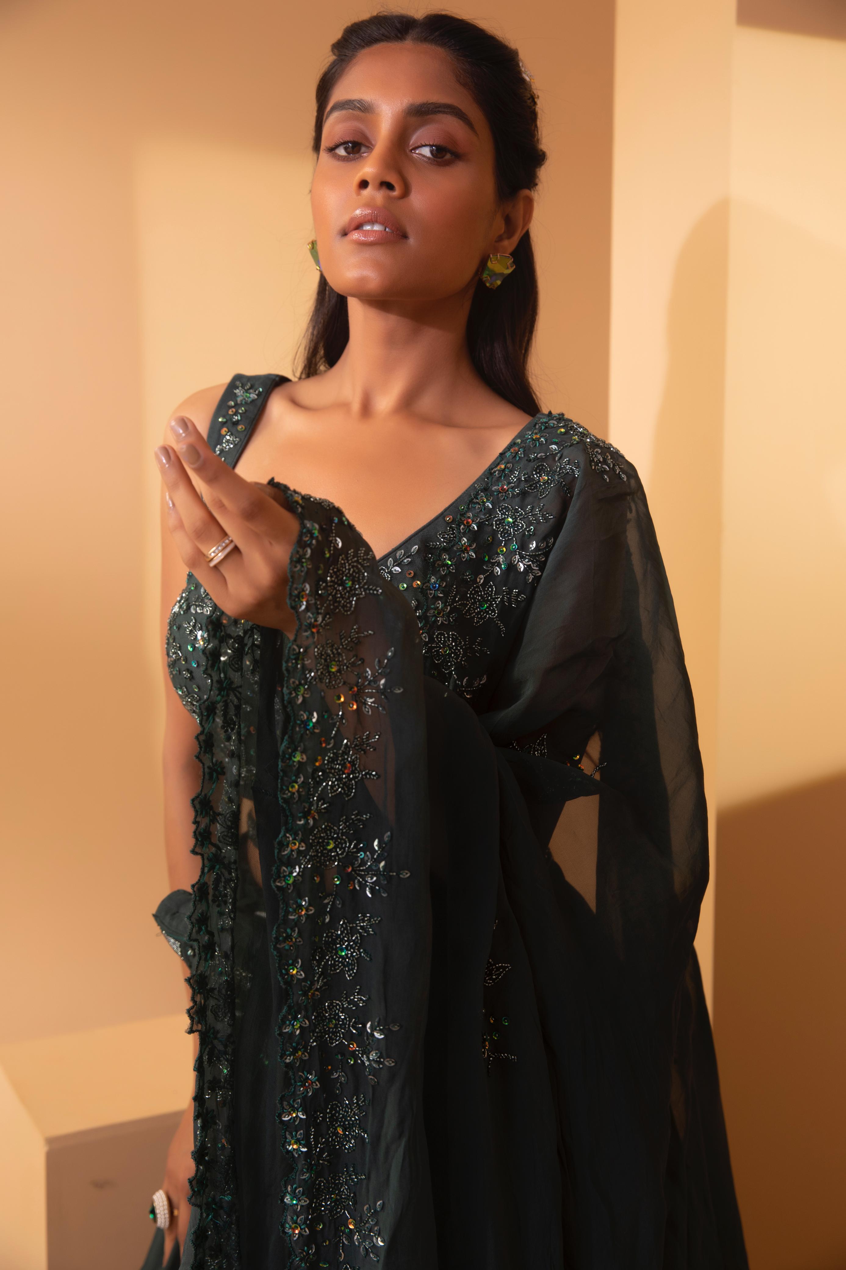A model showcasing Alnitak Cross Belt Lehenga by Miku Kumar from Miku Kumar's collection