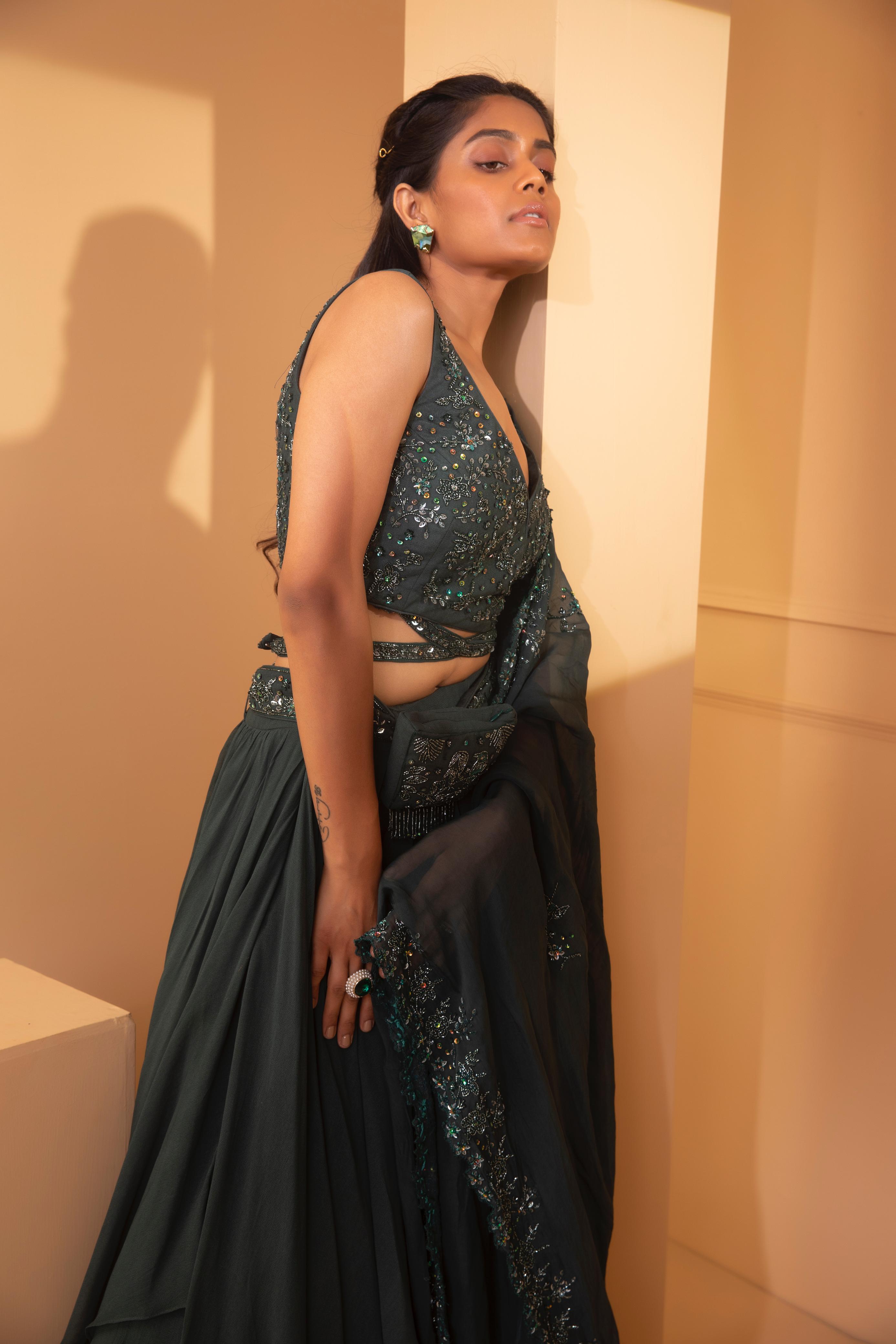 A model showcasing Alnitak Cross Belt Lehenga by Miku Kumar from Miku Kumar's collection