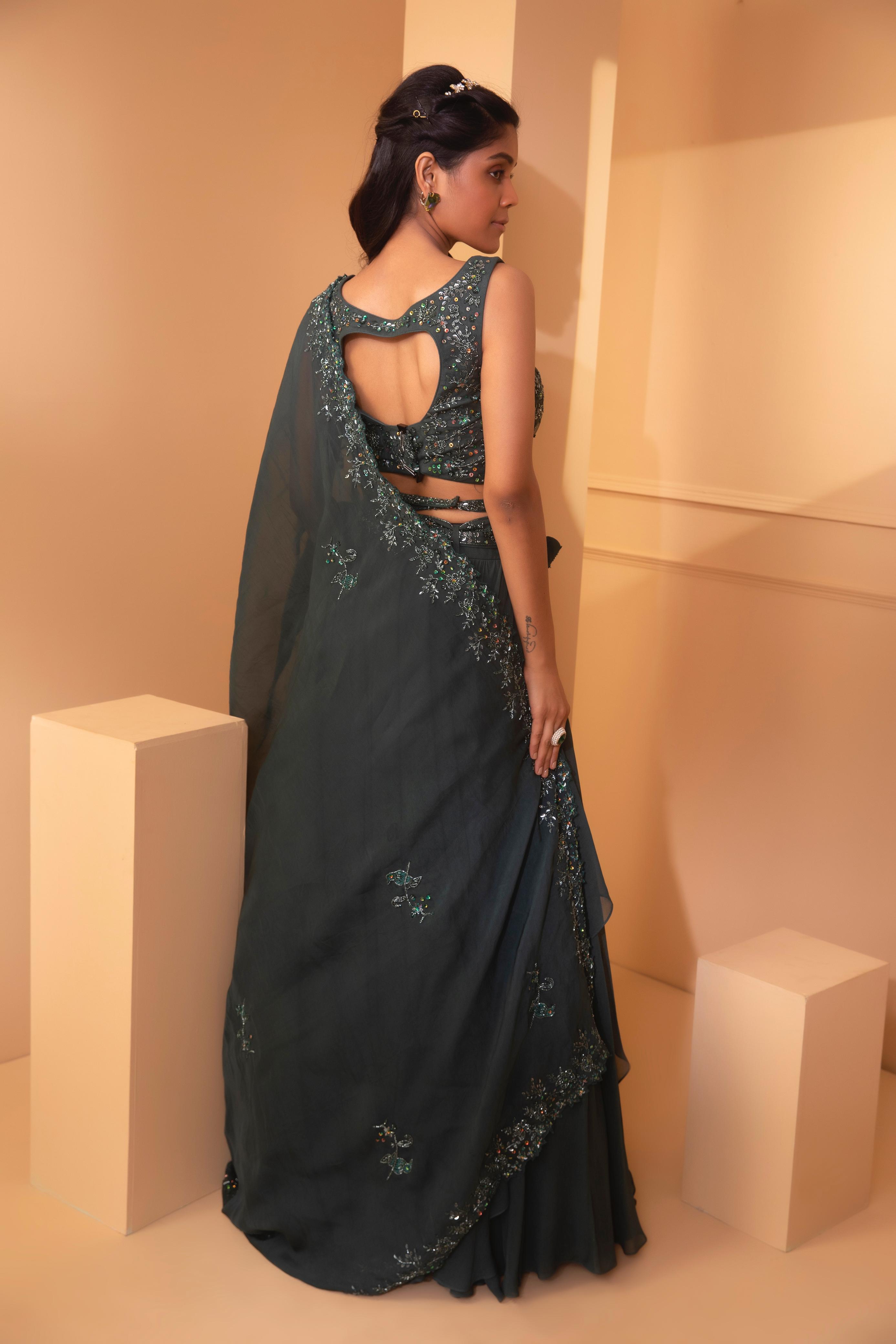 A model showcasing Alnitak Cross Belt Lehenga by Miku Kumar from Miku Kumar's collection