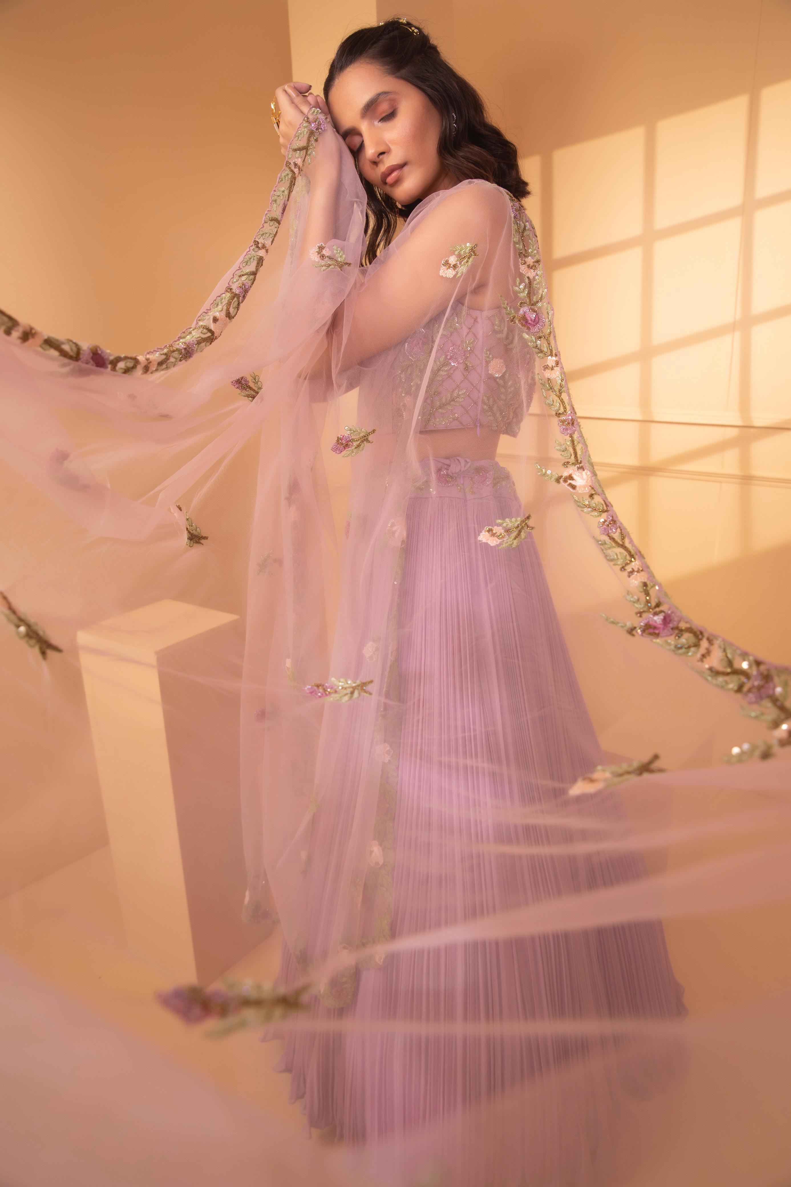 A model showcasing Mintaka Embriodery Lehenga Set by Miku Kumar from Miku Kumar's collection