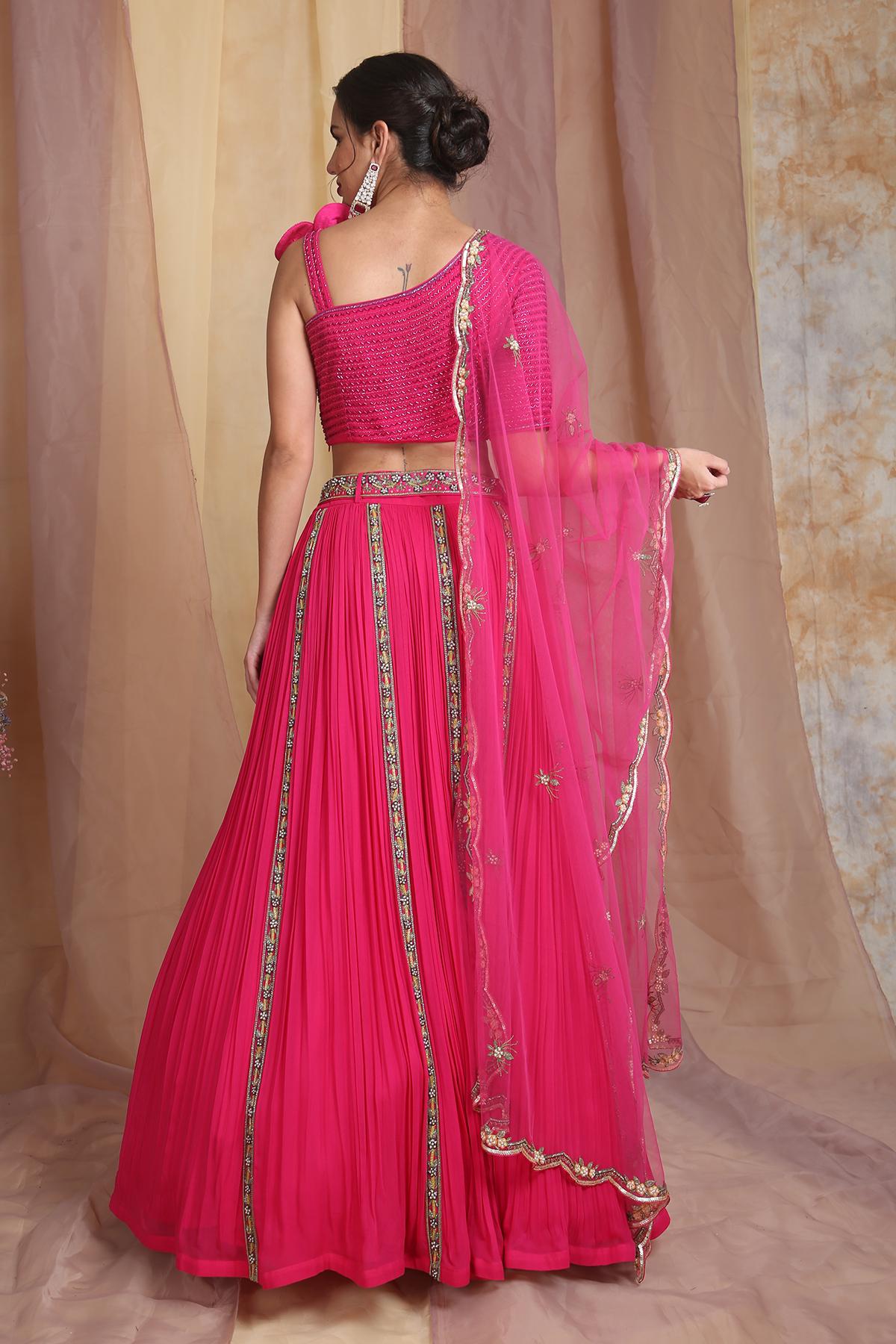 A model showcasing Hot Pink Flora Lehenga Set by Miku Kumar from Miku Kumar's collection