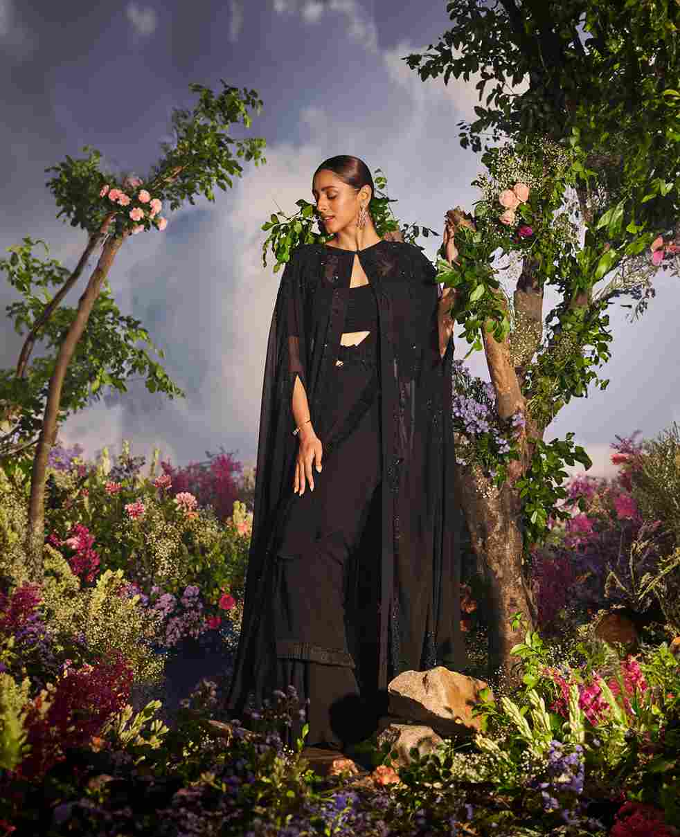 A model showcasing Maya Drape Saree Set by Miku Kumar from Miku Kumar's collection