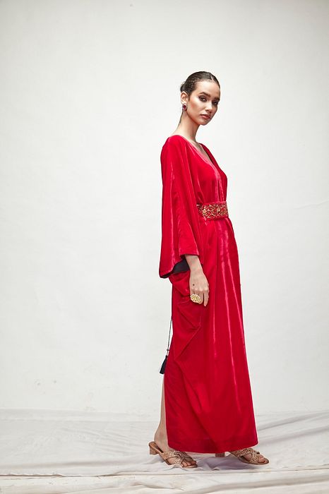A model showcasing Fuschia Velvet Kaftaan by Ranian from Ranian's collection A model showcasing Fuschia Velvet Kaftaan by Ranian from Ranian's collection
