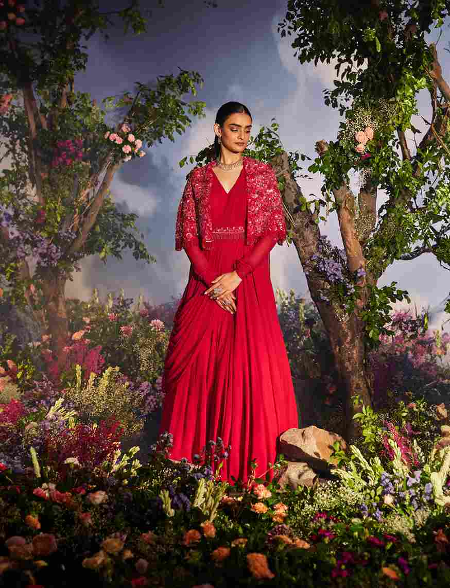 A model showcasing Prisha Cherry Red Anarkali Dress Set by Miku Kumar from Miku Kumar's collection