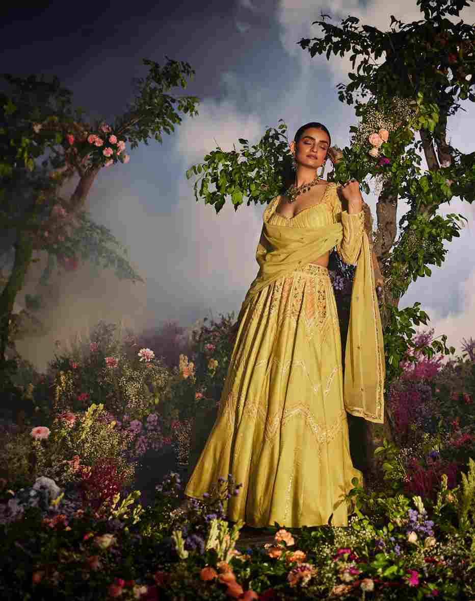 A model showcasing Kyomi Lehenga Set by Miku Kumar from Miku Kumar's collection