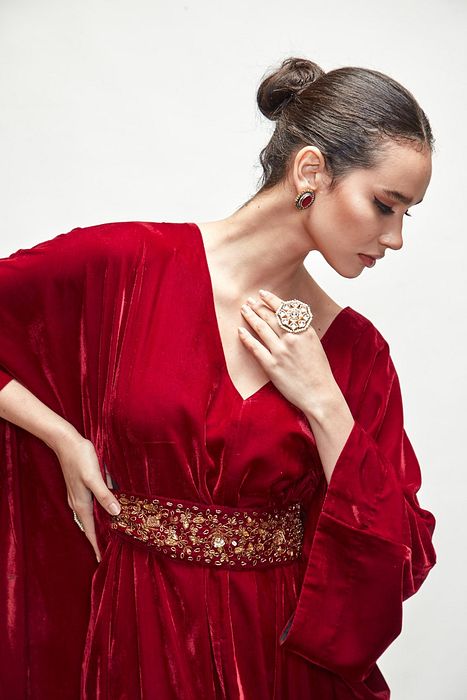 A model showcasing Mahroon Velvet Kaftaan by Ranian from Ranian's collection A model showcasing Mahroon Velvet Kaftaan by Ranian from Ranian's collection