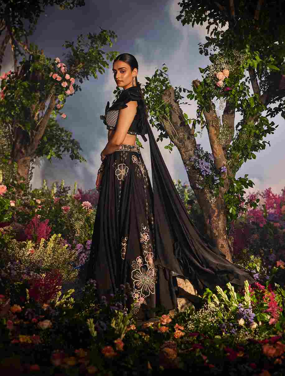 A model showcasing Mishka Lehenga Set by Miku Kumar from Miku Kumar's collection