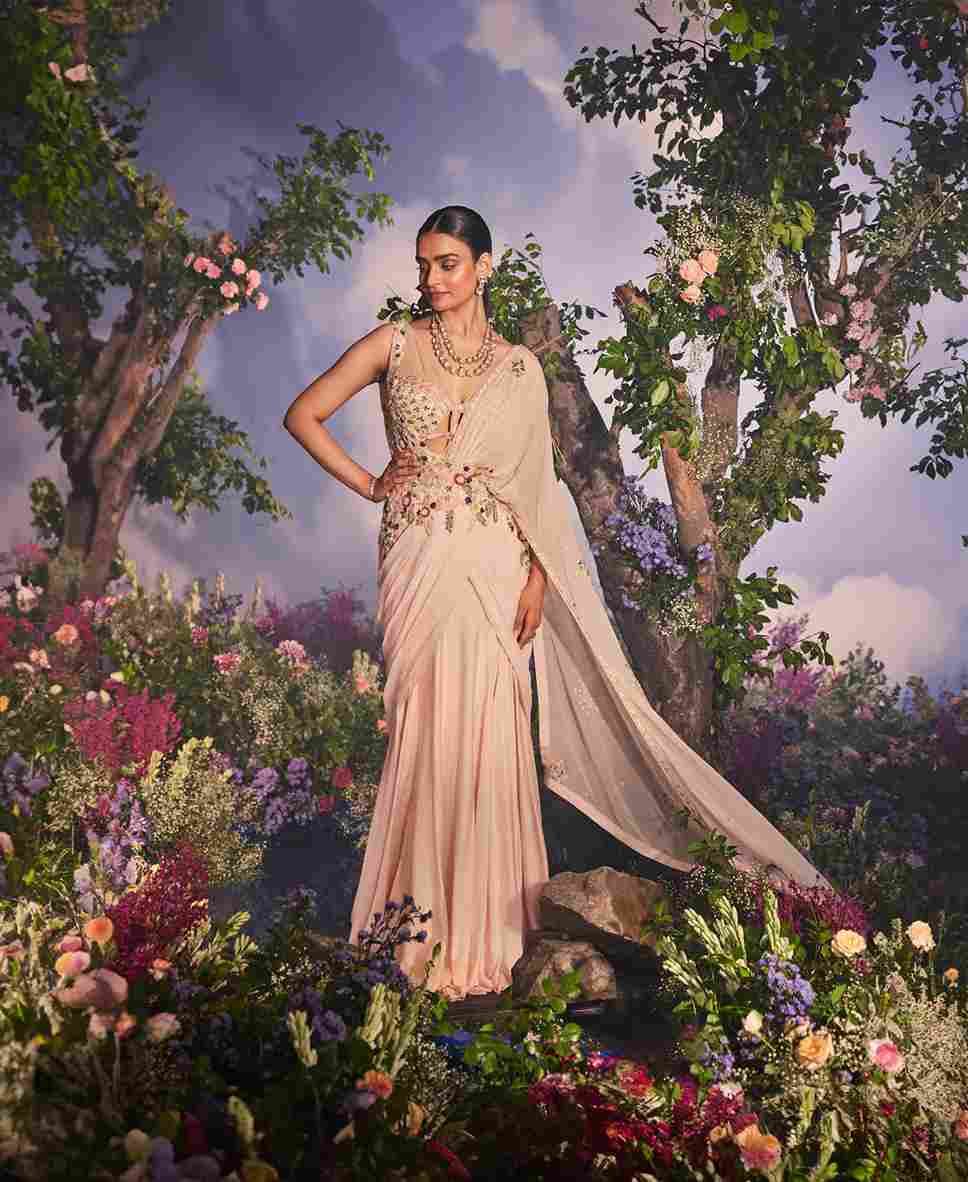 A model showcasing Ava Drape Saree by Miku Kumar from Miku Kumar's collection